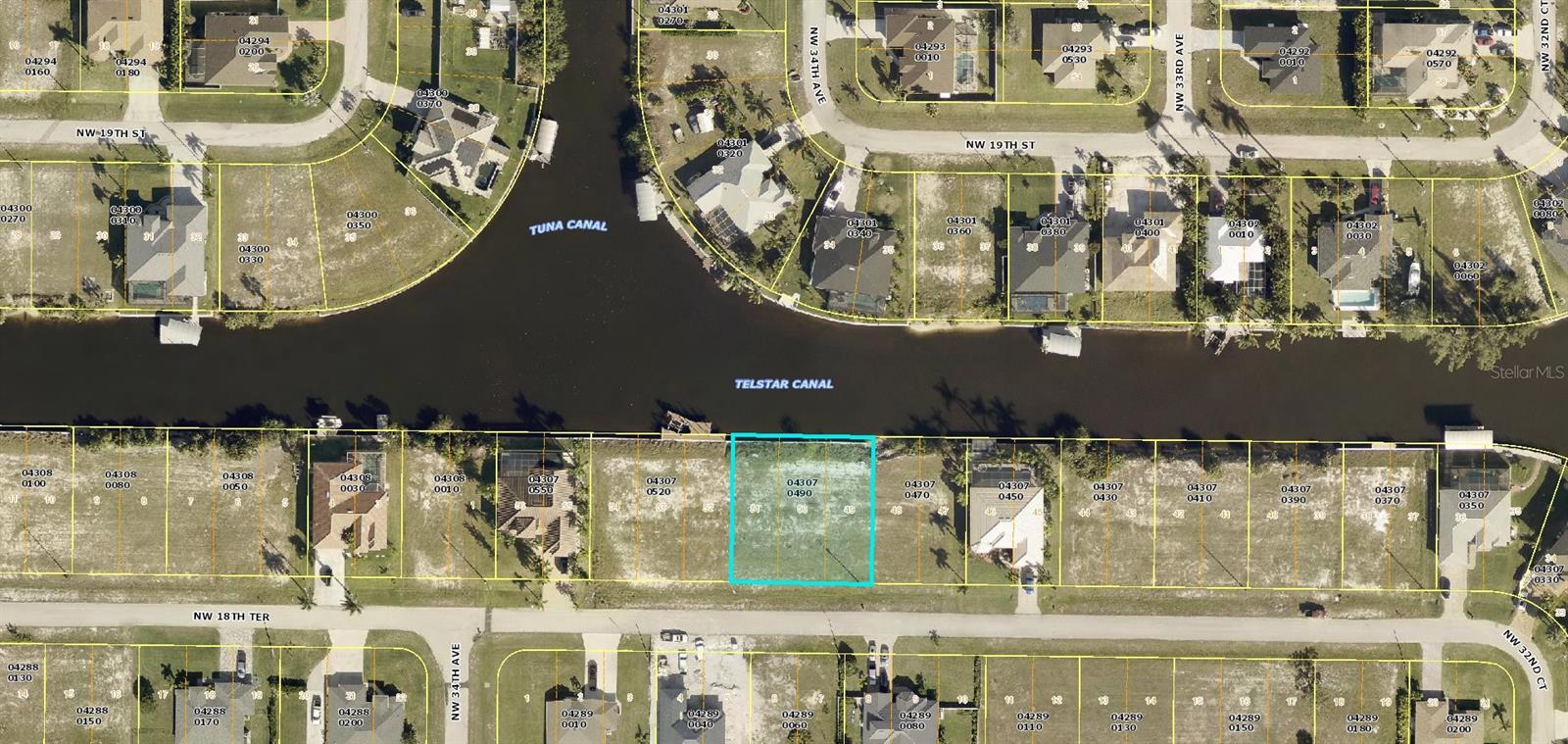 Rare find! Gulf access triple lot that boasts stunning intersecting canal views! A seawall is already in place, saving the next owner tons of money and time! No waiting to build your dream. Nestled in a highly desirable and upcoming neighborhood, this generous property offers the ultimate waterfront lifestyle, offering unparalleled space and privacy around your future home. The unique setting provides scenic water views from all angles, guaranteeing a scenery-filled backdrop for your everyday living. Future homeowners can anticipate memorable boat rides straight from their backyard leading to the captivating open waters. Fishing enthusiasts will absolutely delight in the abundance of marine life in the canals. It's a boater's dream with ample space for a private dock or a boat lift. Don’t wait for this once-in-a-lifetime opportunity to pass you by – inquire today and start planning your future in this waterfront wonderland