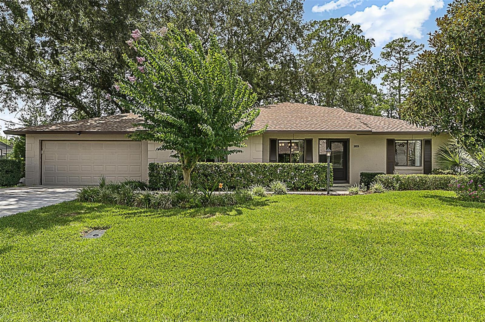 This charming 3-bedroom, 2-bathroom home in the heart of Palm Coast offers the perfect blend of comfort, functionality, and Florida lifestyle. Nestled in a quiet, well-established neighborhood, this meticulously maintained property features a spacious open floor plan with soaring vaulted ceilings and plenty of natural light. Step inside to find a bright and inviting living area, a modern kitchen with stainless steel appliances, breakfast bar, solid surface counters and ample cabinet space—perfect for everyday living or entertaining guests. The bedroom layout provides added privacy, with a generous primary suite featuring a walk-in closet and a private en-suite bath. Enjoy morning coffee or evening breezes on your large covered patio, with cabinet space and closets, overlooking a beautifully landscaped backyard—ideal for relaxing or creating your own outdoor oasis. Inside laundry room with cabinets and oversized garage. Conveniently located just minutes from schools, shopping, restaurants, and the stunning beaches of Flagler County. Whether you're a first-time homebuyer, downsizing, or seeking an investment, this home is a must-see! A/C 2013, Roof 2022 and Water heater 2023. Recent 4 point inspection available.