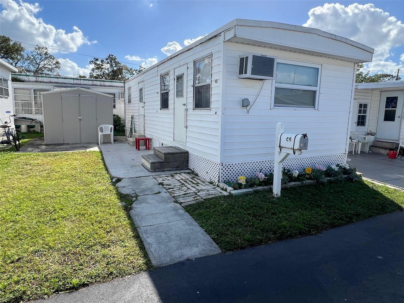 GREAT PRICE! Looking to live in a quaint 55-plus community? Midway AM/CAN is a neighborhood that offers a variety of amenities designed to enhance everyday living. A central highlight is the community clubhouse, where residents gather to socialize, attend events, and participate in group activities. Along with the clubhouse there are well-maintained shuffleboard courts, ideal for friendly games that bring neighbors together. Additionally, the community provides a pay-by-use laundry facility equipped with washers and dryers, complemented by an outdoor drying yard. This peaceful enclave featuring this 1 bedroom, 1 bathroom home, is close to beautiful beaches, enchanting shops, and a wide selection of restaurants, making it easy to enjoy both relaxation and entertainment. With a maintenance fee of just $176.00 per month, residents benefit from essential services, including water, sewer, garbage collection, and lawn care, ensuring a well-kept environment.
INTERIOR
This adorable, fully furnished home offers a cozy and inviting atmosphere, perfect for a move-in-ready experience. The kitchen comes equipped with essential appliances, including a fridge, oven, stove and microwave, making meal preparation convenient and enjoyable. The eat-in area in the kitchen invites you to enjoy meals in a relaxed setting. The living room features a comfortable sleeper sofa, ideal for relaxing or accommodating guests, along with ceiling fans to keep the space airy. A wall unit provides both air conditioning and heat, ensuring comfort year-round. The home’s interior has been carefully maintained, with neat, clean spaces and durable laminate flooring throughout most of the home, except for the bathroom, which features easy-to-clean vinyl flooring. The bathroom itself is thoughtfully designed with a walk-in shower for added accessibility and comfort. The aluminum windows have been upgraded from the original, contributing to energy efficiency while retaining the home’s timeless charm. Storage abounds , with plenty of spaces ready to personalize, offering the flexibility to make it truly your own.
EXTERIOR:
This property includes a convenient parking space for a single vehicle, in addition to a roof over that was replaced in 2019 for added durability and protection. A handy shed offers extra storage for tools, seasonal items, or hobby equipment. Priced at an affordable $40,000, this property also comes with a share, making it an attractive option for those looking for a low-maintenance and affordable living space with practical amenities. This community offers a charming, low-maintenance lifestyle in a prime location for those looking to enjoy their retirement years near the coast. Make a call today to schedule your private showing of this darling home!