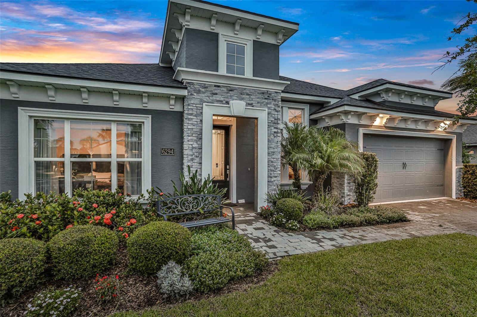 Why wait to build? This like-new former Costa Mesa model home in the gated Woodhaven community of Port Orange is fully loaded with upgrades and ready now. Built in 2020, this stunning 4-bedroom, 3-bath home with den/flex room offers over 2,560 sq ft of beautifully designed living space, a 3-car tandem garage, private pool and heated spa, summer kitchen, and sits on a premium lot designed for maximum privacy and comfort. Interior highlights include soaring 12-foot ceilings, gorgeous tile flooring in the main living areas, quartz countertops, high-end cabinetry, designer lighting and fans, and an expansive chef's kitchen with a massive island that flows into the dining and great room.
Oversized sliders lead to your private backyard oasis with a black-finish pool, spa, tile decking, lush landscaping, and privacy shrubs inside a fully fenced yard. The covered lanai includes a full summer kitchen with a roof-vented hood and built-in grillperfect for entertaining. The owner's suite is a luxurious retreat with double vanities, a large walk-in shower, and spacious closet. The split bedroom layout offers ideal privacy for guests or family, and the den/flex room is perfect for a home office, gym, or creative space. Bonus features include a built-in pet washing station, washer and dryer included, and a whole-house salt-based water filtration system. Located in one of Port Orange's top school districts, with nearby elementary and middle schools and high school bus service. Close to I-95, I-4, shopping, dining, New Smyrna Beach, historic DeLand, and Orlando International Airport. This former model home has it allcome see it before it's gone!