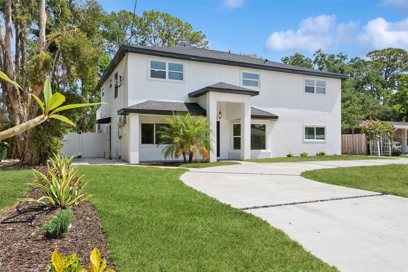 One or more photo(s) has been virtually staged. Step into this fully renovated, professionally designed 6-bedroom, 5-bathroom residence—complete with a separate legal 1-bedroom, 1-bath attached apartment (ADU) offering exceptional income or multigenerational living potential. Perfectly positioned just east of Downtown Sarasota and adjacent to the Legacy Trail, this property blends luxury, functionality, and location.
From the moment you enter, you're greeted by abundant natural light, thoughtfully placed windows, and serene views of lush, mature landscaping. The open-concept layout flows effortlessly, with the main residence featuring two bedrooms downstairs and four en-suite bedrooms upstairs—including a luxurious primary suite with multiple closets and a spa-inspired bath.
A generously sized guest bedroom and a spacious family room open to a full-width second-story deck, creating a seamless indoor-outdoor retreat ideal for entertaining or relaxing. The chef’s kitchen is the heart of the home, outfitted with GE appliances, classic shaker cabinetry, and stunning custom Calacatta Statuario waterfall quartz countertops.
No detail was overlooked in the full-gut renovation, which also includes: Fiandre Italian porcelain tile and Delta fixtures in all baths, 7-inch wide plank white oak flooring throughout, Smart thermostats and doorbell system, Brand-new roof, impact-rated windows, plumbing, water service, sewer, and electrical. Main house and the apartment have separate utilities.
The oversized backyard presents endless possibilities—whether you envision a resort-style pool, outdoor lounge area, or garden retreat. The covered lanai is ready for a future outdoor kitchen, further extending your living space from the kitchen and family room.
A circular driveway offers ample parking for multiple vehicles, making this home ideal for families, guests, or short-term rentals.
Located just minutes from downtown Sarasota and a short drive to Siesta Key Beach, this is the turnkey, design-forward home you've been waiting for—offering the rare blend of lifestyle, luxury, and long-term value.
Virtual Tour: https://my.matterport.com/show/?m=CF1BV51F1HH&mls=1