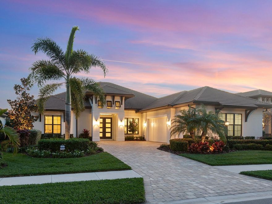 Presenting 741 Crosswind Ave, an exceptional Lee Wetherington custom-built coastal home, on Lake Mallard with breathtaking expansive water vistas that offer astonishing colorful sunsets! Embrace the beauty of your surroundings in this idyllic lakeside retreat. Upon entering, the ambiance is set by a sophisticated built-in wet bar featuring Cambria quartz countertops, a dual-zone wine refrigerator and a meticulously designed wine locker cellar with a tumbled stone floor and bronze wine racks for up to 66 bottles. This space opens to the great room, facilitating effortless entertainment. The great room itself boasts entire sliding glass doors that reveal the screened lanai, where an oversized resort-style inground saltwater heated pool with a captivating fire feature and programmable lighting awaits. The outdoor oasis further impresses with a spa, kitchen and two covered entertainment areas, all adorned with elegant travertine flooring. The heart of this home is undoubtedly the gourmet kitchen, equipped with top-of-the-line appliances, including a Wolf gas cooktop, Cambria countertops, custom cabinetry with large drawers and a 10-foot center island that doubles as a breakfast bar. The kitchen seamlessly flows into the great room and a dining area with corner disappearing sliding doors, creating a harmonious blend with the outdoors. The owner's suite offers a peaceful retreat, featuring a generously sized bedroom that leads to an elegant primary bath. This spa-like bath includes a walk-in shower with multiple shower heads, a separate deep soaking tub and a single vanity with separate sinks. The suite connects seamlessly to a spacious walk-in closet and is conveniently linked to the laundry room. Two guest en suites, each with private full baths and walk-in closets, ensure every guest enjoys comfort and privacy. Discover a versatile media and piano room with shelving that can double as a reading room or a second office. Enjoy the tranquility of the large lake from the private oversized den and office at back of the house, featuring an entire wall of custom-built shelves and cabinets, while allowing you to enjoy the tranquility of the large lake and pool views. Additional features include a large three-car garage with a mini-split air conditioner, a climate-controlled Florida basement for optimal storage, impact windows and doors throughout. Architectural details such as double-tray ceilings elevate the custom feel of this home. The property is equipped with a two-zoned HVAC system, tankless water heater, surveillance cameras, extensive lush tropical landscaping with accent lighting, gutters and more. Exceptional water views provide a backdrop of elegance and peacefulness, making this residence a haven of luxury and comfort. Waterside community encompasses seven lakes and 20 acres of shoreline, nature preserves and walking trails. Enjoy a variety of shopping and dining options and water taxi from Lakehouse Cove boat house to Waterside Place Marina. Lakehouse Cove residents have access to a rich-filled amenity center with a resort-style pool, spa, lounging cabanas, fire pits, play area, pickleball courts, bocce ball and a 24-hour fitness center. Meet up with your friends and neighbors in the luxurious clubhouse with fully equipped kitchen, board and meeting room, game room and outdoor verandas. This custom-built coastal home represents a rare opportunity to own a piece of paradise. Room Feature: Linen Closet In Bath (Primary Bathroom).