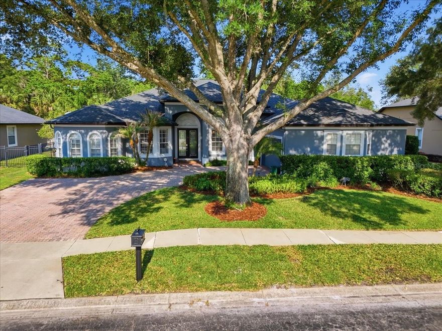 Exceptional luxury living awaits in this beautifully reimagined 5-bedroom, 3.5-bath residence located within an exclusive gated community. Offering over 3,100 square feet of refined living space, this impressive home showcases luxury finishes and thoughtful upgrades throughout, including elegant travertine flooring, rich oil-rubbed plank floors, and a stunning updated kitchen appointed with stainless steel appliances.

Designed for both elevated entertaining and everyday comfort, the spacious interior flows seamlessly to a private screen-enclosed pool retreat featuring a resurfaced finish, travertine pavers, and a fully fenced backyard oasis. The luxurious primary and guest baths have been tastefully updated, while major improvements such as a 2019 roof, hurricane impact slider doors, and fresh exterior paint provide peace of mind and timeless appeal.

Perfectly positioned near top-rated schools, upscale shopping, dining, and convenient 417 access, this exceptional residence delivers the ideal blend of luxury, comfort, and location.