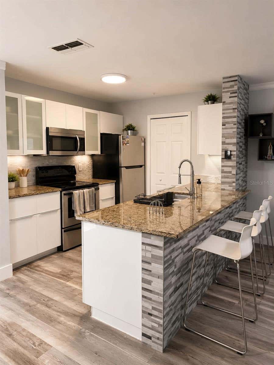 Photo of 5463 Vineland Road #5203, Orlando, FL 32811 (MLS # S5154919)
