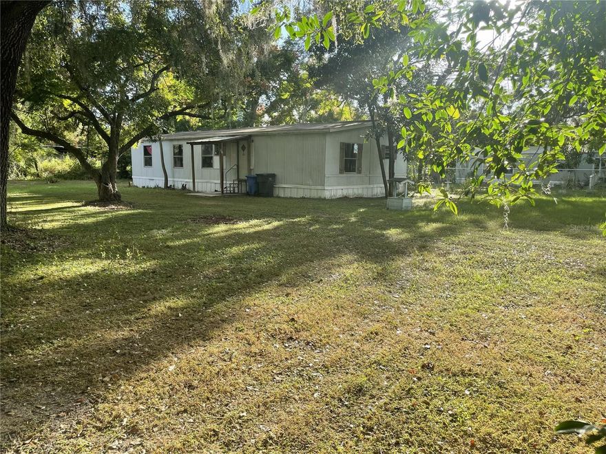 Discover potential on this .36-acre (approx. 78 ft by 225 ft) parcel nestled along charming and tranquil Pruett Road in unincorporated Thonotosassa South, Hillsborough County. A 3-bedroom, 2-bathroom distressed double-wide mobile home, offering 1,344SF of heated living space built in 1978, awaits a fresh vision; sold strictly AS-IS, ideal for those seeking a renovation project. The AS-1 zoning does allow for a new SF home to be built for buyers future planning. The neighborhood is transforming rapidly, with exciting new residential communities like Graceland Estates and Evergreen rising nearby, an Amazon Distribution Center less than 1 mile away, and a growing appetite for mixed-use and industrial developments fueling regional momentum. For additional strategic opportunities, the adjacent mobile home park is also for sale; reach out to the agent for more details. Whether you're looking to revive this home, build your own, or invest in redevelopment, this location offers both privacy and access to the dynamic growth unfolding around it. Buyer to verify utilities, condition, permitted uses; all listing details are drawn from public records.  Property has well/septic. Must show proof of funds prior to seeing.