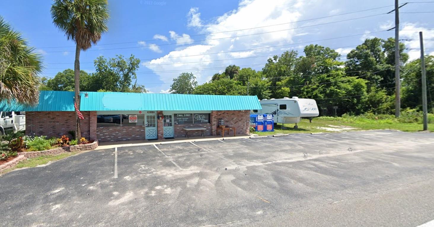 "Prime Retail/Business Building in New Smyrna Beach, FL: Strategically Positioned at Intersection for High Traffic Visibility. This concrete block building offers unparalleled strategic positioning in the heart of New Smyrna Beach. Nestled in a bustling neighborhood surrounded by residential areas, schools, restaurants, bars, and coffee houses, this property promises continuous foot traffic and activity. Constructed in 1955, it has long served as a hub for various business ventures, benefitting from heavy day-time traffic every day of the year.
Sitting on a sturdy slab foundation, this 2,100 sq. ft. building is centrally air-conditioned for comfort. The fenced storage area at the back, complete with washer/dryer hookups, ensures both security and convenience. Zoned B-5, Planned Shopping Center District, it is primed for retail shopping establishments catering to the local community's needs.
Featuring a captivating front view overlooking W. Canal, this property boasts a spacious reception area, three large rooms, and two restrooms, all designed to enhance customer comfort and satisfaction. The flat tar, paper, and metal roof provide year-round comfort, while the expansive 10,889 sq. ft. lot offers ample space for parking and potential expansion.
With its attractive block, brick, and concrete exterior, this building presents an ideal canvas for prominent business signage, ensuring maximum visibility. Whether transformed into a professional office, retail store, or any other business venture requiring high visibility and foot traffic, this property offers boundless potential.
Don't miss out on this exceptional opportunity! Contact the listing agent today to schedule a private showing."