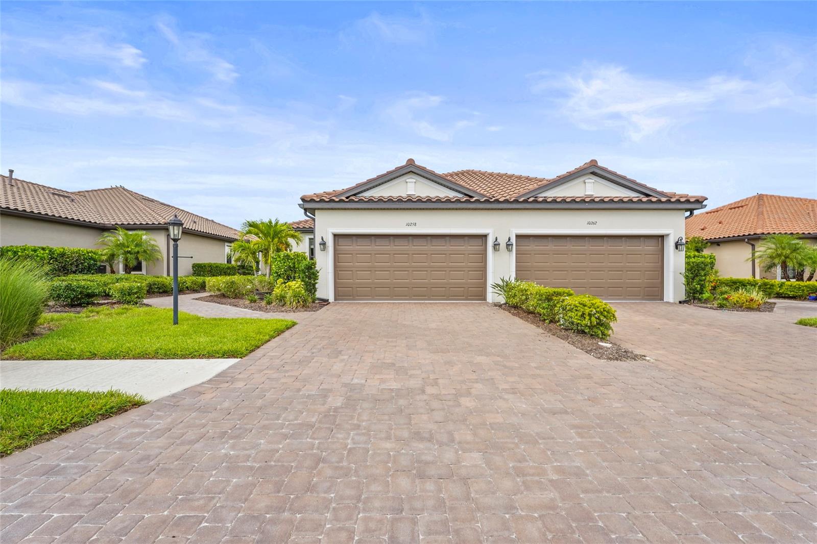 Please, welcome to this beautiful villa located in the community of Esplanade on Skye Ranch.This well constructed home is loaded with upgrades and provides remarkable views of the serene lake with no homes on the other side. Situated on a premium lake front lot and a short distance to the community pool.
2 bedrooms, Den, 2 Baths, 8' doors and a modern kitchen that flows into a bright, airy living space. This home is flooded with natural light from abundant windows and has an open floor plan for great family time and ease of entertaining. The home has spacious rooms with high ceilings, and interesting architectural detailing (tray ceilings, etc). The kitchen is the center piece of this home and is large, with wooden cabinetry topped with solid quartz counters with breakfast bar, custom tile backsplash, stainless steel appliances (gas stove) and a pantry. The lanai has been extended (28’ 0” x 16’0”) providing ample space for relaxing in the evening or enjoying outdoor time with friends and family. Enjoy lake views from the primary bedroom as well through the triple window. The 2nd bedroom is light and bright, complete with a tray ceiling and a walk-in closet. And has a tub/shower combo. The Flex Room offers plenty of privacy and can be used as a third bedroom. Other upgrades on this home include an epoxy finished garage floor, paver driveway and private paver entrance.
You will benefit from a lower CDD than is currently available as well as solid construction - tile roof, concrete block construction and this home is not in a flood zone.
Live in the gated resort community of Esplanade at Skye Ranch and enjoy ease of included lawn care, multiple amenity campuses including the newest exclude Esplanade amenity under construction – the Venue which will have a Bahama Bar restaurant, spa service, resort pool and more. A short drive west will get you to Siesta Key Beach an only 5 miles to I75 for an easy commute! This home is close to shopping and dining at both UTC and downtown Sarasota!
Some of the amenities at Skye Ranch include the HUB (180,000 gallon resort pool, clubhouse, indoor basketball court, pickleball, café, fitness center and movement studio, BBQ grills and outdoor dining, fire pit) tennis, park and trails and multiple pools. The lifestyle and fitness directors ensure a full calendar of events and classes so there is something for everyone.
Seller Financing may be considered with the right offer!