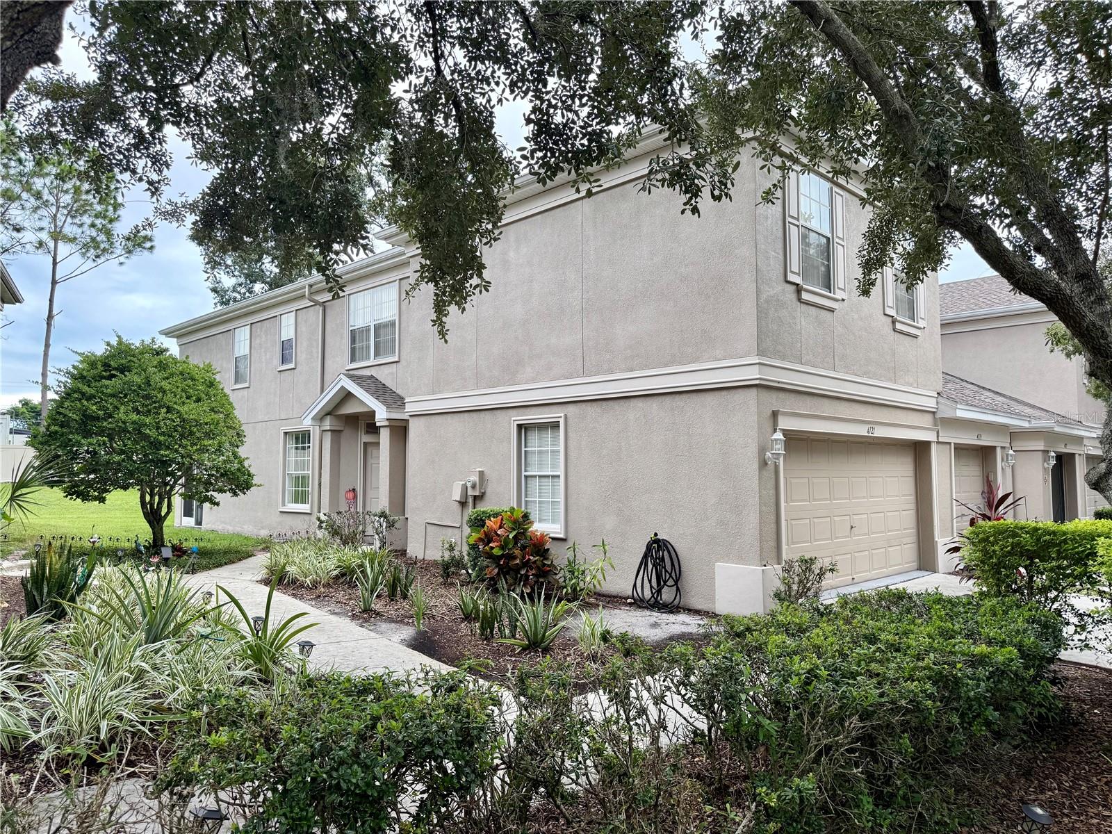 Welcome to this beautifully maintained and spacious 2-bedroom, 2.5-bath townhome with a 2-car garage in the highly sought-after Sabal Pointe community! As an end unit, you’ll benefit from extra windows and abundant natural light, ensuring privacy with no side neighbors. The home welcomes you with an open-concept layout highlighted by durable luxury flooring. The kitchen is well-equipped with stainless steel appliances, a breakfast bar, and a pantry for added convenience. The living space transitions effortlessly to your private screened-in lanai, offering tranquil views that create the perfect setting for outdoor relaxation. Upstairs, you’ll find two generously sized bedrooms, two full bathrooms, and an open loft that can be utilized as an office, gym, playroom, or easily converted into a third bedroom. The primary suite features a walk-in closet and vaulted ceilings, adding to the home’s appeal. Sabal Pointe is a pet-friendly community with low HOA fees and a refreshing community pool. With its convenient location near I-75 and I-4, this home offers easy access to shopping, dining, entertainment, and Tampa International Airport. Don’t miss your chance to make this exceptional property your new home! Experience the perfect low-maintenance lifestyle in this stunning end-unit townhome. Quick access to shopping, dining, highways, and entertainment, making everyday life convenient and enjoyable. (Roof 2023 and A/C 2018) **More Photos Coming soon. Currently occupied until 10/01/2025**