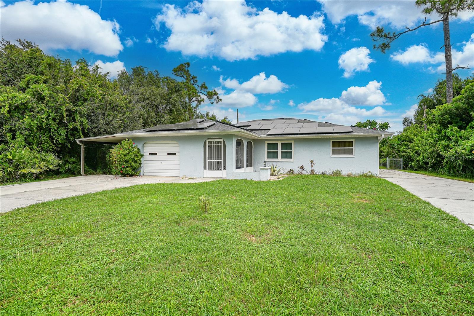 Welcome to 1074 Darby Dr NW in Port Charlotte! This inviting 3-bedroom, 2-bathroom pool home offers an incredible opportunity to enjoy the Florida lifestyle at an affordable price point of $277,714. With more than 1,700 square feet of living space, a 1-car garage, carport, and extra poured-concrete parking pad, this property was designed with practicality and convenience in mind—perfect for anyone needing room for vehicles, boats, or recreational toys.
Inside, the home offers a smart and functional layout that gives you the perfect foundation to create the home of your dreams. A spacious living area flows into the kitchen and dining spaces, offering plenty of room for everyday living or entertaining. With three comfortable bedrooms and two full bathrooms, there’s space for family, guests, or even a home office. The home also features solar panels, providing energy efficiency and long-term cost savings—an upgrade you’ll continue to benefit from for years to come.
Step outside and you’ll find your private Florida retreat. The screened-in pool is ready for sunny afternoons, weekend gatherings, or relaxing evenings at home. The backyard is designed for both relaxation and recreation, with space to enjoy as it is or enhance further with your own personal touches.
This home sits on a generously sized lot in a well-established neighborhood, giving you both privacy and convenience. You’ll be close to shopping, dining, schools, and some of the best recreational opportunities Charlotte County has to offer—from golf courses and parks to marinas and Gulf beaches. Whether you’re looking for a full-time residence, a seasonal getaway, or a property with great investment potential, this home checks all the boxes.
What makes this home special is its combination of “good bones” and endless potential. With a solid structure, desirable features already in place, and room to update or personalize, it’s easy to picture yourself making this property truly your own. Add your style, create the spaces you’ve been dreaming of, and enjoy the peace of mind that comes with owning a home that offers both value and opportunity.
Don’t miss the chance to see why 1074 Darby Dr NW is more than just a house—it’s a place where the next chapter of your Florida lifestyle begins. Schedule your showing today and imagine all the possibilities this property has to offer.