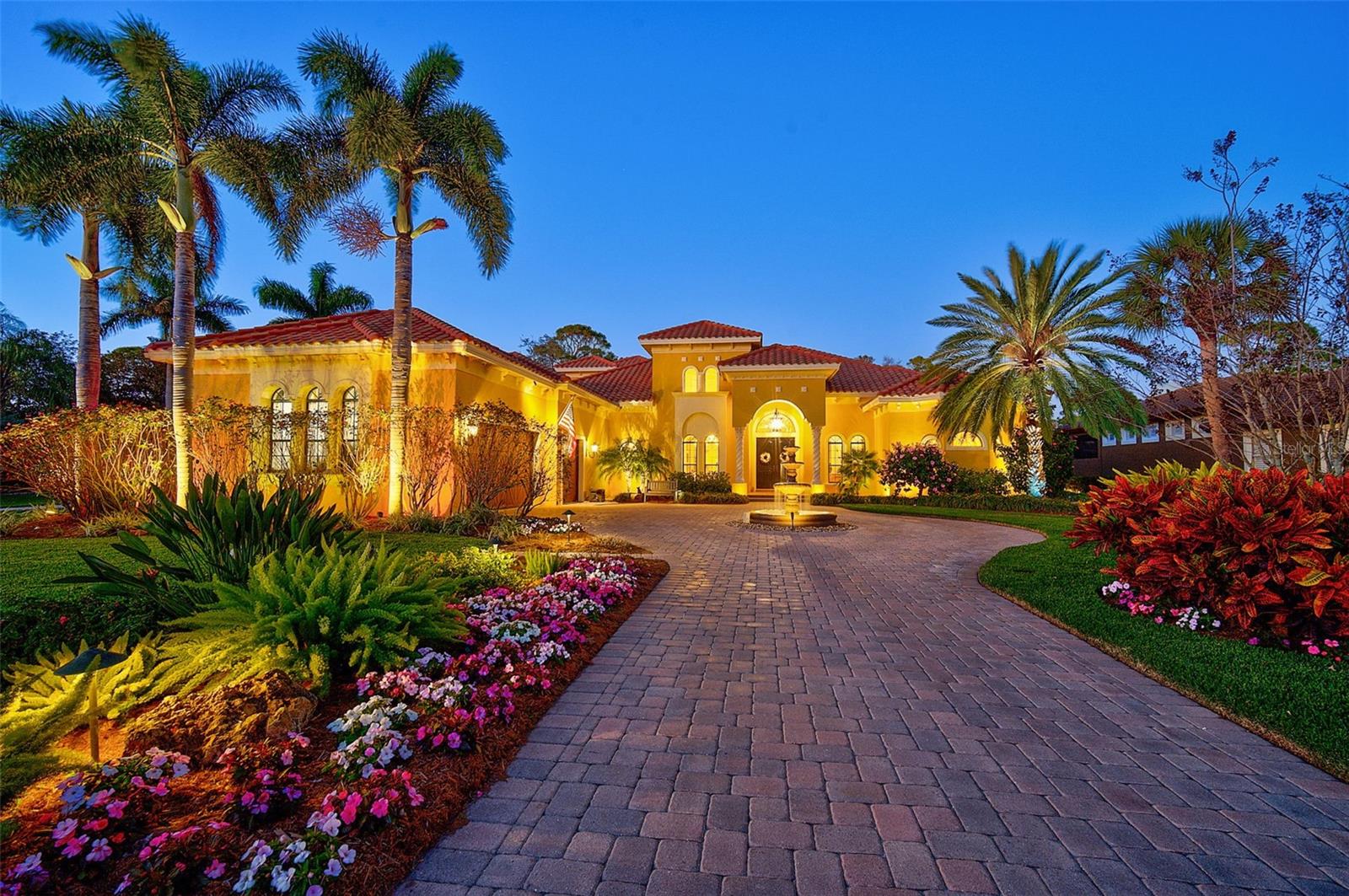 **EXCEPTIONAL and METICULOUSLY MAINTAINED, CUSTOM GOLF COURSE ESTATE built by JOHN CANNON in 2008** is situated on an Over Half Acre, Private and Serene Lot with Golf Course and Water Views in THE OAKS COUNTRY CLUB Community. NEW ROOF (2021), GENERATOR (with 1000 Gallon Propane Tank) and HURRICANE IMPACT WINDOWS & DOORS. From its Stunning Curb Appeal to its Tastefully Appointed Interior, this Magnificent Residence of nearly 4500sf with 4-Beds PLUS Study/Den and 4 Full Baths offers 1st Floor Living plus a Private 2nd floor bedroom suite with Bonus Room and Balcony. This home features a grand Mahogany double door entry, Travertine Marble and Engineered Hardwood flooring, Coffered Ceilings, Crown Moldings, 2 Gas Fireplaces, Onyx Wet Bar with floor-to-ceiling wine storage room, a well-equipped Chef’s Kitchen with Granite Counters and premium Stainless Steel appliances including SubZero, Thermador, Bosch, many Built-Ins and much more! A Sprawling Primary Bedroom Suite features dual vanities, large custom-tiled twin shower, soaking tub and walk-in closet. Enjoy the utmost in Outdoor, Florida Living in an Expansive Screened Lanai with Impressive Outdoor Kitchen, Generous Dining and Gathering areas with Cozy Fireplace, Heated, Saltwater Pool & Spa and adorned with Professional Outdoor LED Landscape Lighting throughout the grounds and including the pool cage. THE OAKS is a distinguished country club community which boasts many accolades including: Platinum Club of America, Emerald Club of the World and Elite Distinguished Club of the World - where amenities include two, 18-hole championship GOLF courses, award-winning TENNIS program with 12 Har-Tru Hydro-Grid tennis courts, 4 Pickleball Courts, state-of-the-art FITNESS center and junior Olympic, heated community SWIMMING POOL. The Oaks is just minutes from nationally ranked Pine View School, the Legacy Bike Trail, area Beaches and all that Gulf Coast living has to offer. Equity OR Social Membership is required and available. **ENJOY THE 3D VIRTUAL TOUR**