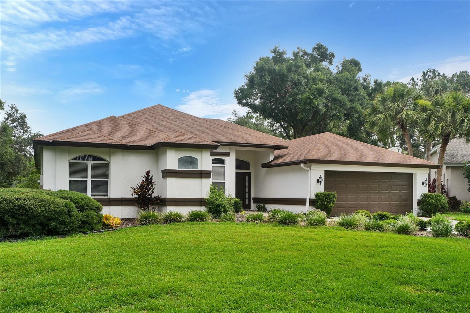 Welcome to your Florida dream home in the sought-after River Hills golf course community, nestled in the heart of Valrico! This meticulously maintained 4 bedroom, 2 bath pool home offers a perfect blend of casual elegance and resort-style living, set amid tree-lined streets and lush fairways. Whether you’re seeking a tranquil family retreat or a vibrant space for entertaining, this residence stands ready to impress. From the moment you arrive, you’ll be captivated by the home’s manicured landscaping, classic architectural details, and inviting entry. The property is situated on a large corner lot with mature oaks shading the front yard and a paver walkway leading to the stately front door. You’ll step inside to an open, sunlit layout where every detail has been thoughtfully crafted. The foyer opens to formal living and dining areas, perfect for gatherings. Wood flooring and fresh, soft paint tones provide a versatile backdrop, while large windows frame picturesque views and bathe the rooms in natural light. The heart of the home is a generous family room, complete with high ceilings and sliding glass doors that seamlessly connect to the pool and lanai. Adjacent, you’ll find a well-equipped kitchen boasting upgraded cabinetry, granite countertops, stainless steel appliances, and a bar area. The kitchen offers ample workspace and storage, making meal prep a delight, whether you’re whipping up a quick snack or hosting a holiday feast. The primary suite is a sanctuary, featuring a walk-in closet and a spa-inspired bath with dual vanities, and separate shower. Three additional bedrooms are generously sized, each with abundant closet space and easy access to a full hallway bath with modern fixtures and stylish finishes. Florida living is all about embracing the outdoors, and this home delivers an exceptional space to do just that. The screened lanai opens to an expansive pool with sparkling waters. Host summer gatherings, relax after a round of golf, or enjoy an evening swim under the stars. The backyard has lush landscaping for added privacy and the covered patio provides shade for year-round enjoyment. he outdoor entertaining space offers a tropical ambiance and plenty of room for dining, gardening, or play. The community is renowned for its golf course, winding fairways, and scenic lakes. Residents enjoy 24-hour gated security, walking trails, playgrounds, tennis courts, and a country club with fine dining and social events. Nature abounds, with local wildlife and peaceful ponds contributing to the neighborhood’s relaxing atmosphere. River Hills is ideally located in Valrico, placing you moments away from outstanding schools, boutique shopping, dining, and recreation. Commuters will appreciate convenient access to major highways, making trips to downtown Tampa, beaches, and area attractions a breeze. The area is celebrated for its welcoming spirit and vibrant lifestyle, making it a wonderful place to call home. This residence effortlessly combines the serenity of golf course living with the excitement of a vibrant community. Imagine waking up to views of rolling greens, spending afternoons poolside, and socializing with friendly neighbors. Whether you’re a passionate golfer, a growing family, or seeking a peaceful Florida haven, this property offers everything you need to make this spectacular River Hills pool home yours. Schedule a private tour today and experience Valrico living at its finest!