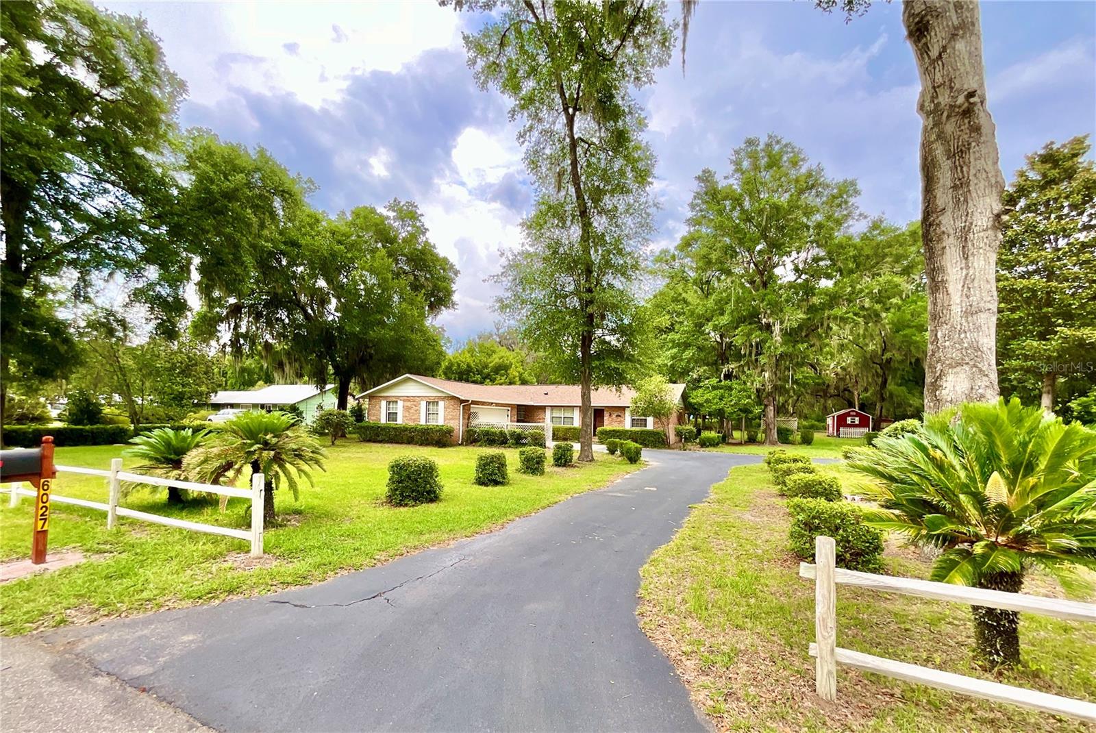Nestled in the heart of Downtown Historic Melrose, this charming 3-bedroom, 2-bath brick facade home offers 1,753 square feet of heated and cooled living space on a spacious 0.67-acre lot. Enjoy deeded ownership to a private Lake Santa Fe waterfront lot spanning over an acre with 254 feet of lake frontage, featuring a manicured beach, peaceful seating area, private boat ramp, and dock perfect for boating and fishing. The home boasts a 2024 roof, 2023 HVAC, split floor plan, a generous primary suite with walk-in closet, large laundry room, separate dining room, and an expansive screened back porch overlooking the backyard. Additional highlights include a 2-car attached garage and a backyard storage shed. With walkable access to local shops, art galleries, restaurants, medical offices, and more, plus an easy commute to Gainesville, this property combines lakeside tranquility with small-town convenience. Schedule your tour today!