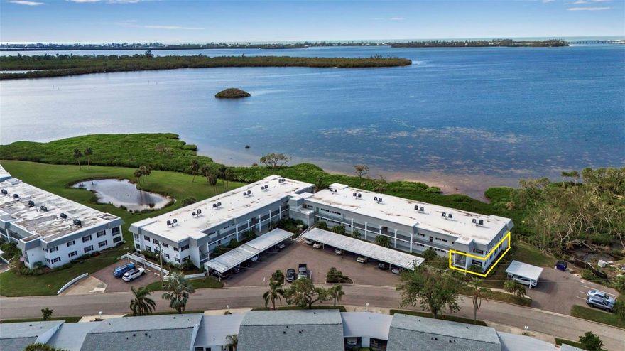Welcome to paradise in the highly sought-after Mount Vernon community with open, million dollar bay views and gorgeous sunsets!  This immaculate 2-bedroom, 2bath ground floor end unit with a carport offers the perfect blend of comfort, convenience and coastal charm.  It is a rare opportunity for a bayfront, ground floor end unit to come on to the market and this one is in pristine move-in ready condition and is being sold turnkey furnished. From the moment you enter you will fall in love with the light filled open living and dining areas, beautiful decor, peaceful setting and expansive water views all the way out to the Longboat Key bridge and gulf. This condo is ready for you to enjoy the effortless Florida living in this well maintained and active 55+plus community known for it's spectacular waterfront and park like setting. Residents of Mount Vernon enjoy an active, resort-style lifestyle featuring a clubhouse, heated swimming pool, tennis and pickleball courts, bocce ball, shuffleboard, fitness center, walking and biking trails, a kayak launch and storage, a bayfront covered pavilion with grills, and a boat ramp providing access to the bay and individual boat slips with boat or RV storage with only a $25 one-time fee (when available, may be a waiting list). The community also offers workshop and hobby rooms along with a variety of social clubs and activities, creating a vibrant and welcoming atmosphere. Mount Vernon also offers an outstanding proximity to the region’s most desirable destinations including Anna Maria Island, Longboat Key and downtown Sarasota, making it easy to enjoy Sarasota’s cultural scene and the areas Gulf Coast beaches. Flood insurance is not required by the association and not included in the fees but the Seller does have a transferable flood policy that could be transered at closing.  Whether you're looking for a full time residence or seasonal retreat this condo checks every box! Schedule your private showing before this gem is gone!