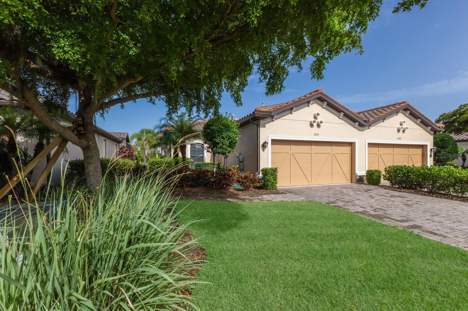 LOCATION, LOCATION, LOCATION!!! ESPLANADE BY SIESTA KEY IS A VERY SPECIAL COMMUNITY LOCATED VERY CLOSE TO SIESTA KEY, JUST A FEW MINUTES TO WORLD FAMOUS SIESTA BEACH, GREAT RESTAURANTS AND CONVENIENT SHOPPING. ESPLANADE BY SIESTA KEY IS A GATED COMMUNITY, HAS A BEAUTIFUL CLUB HOUSE, RESORT POOL, SPA, TENNIS AND PICKLEBALL COURT, FITNESS CENTER, FIRE PIT WITH SEATING, LAKE SIDE PATIO, AND A DOG PARK. THE REASONABLE HOA FEE INCLUDES EXTERIOR BUILDING AND LANDSCAPE MAINTENANCE! UPGRADED FLOOR TILE ACCENTS THIS BEAUTIFUL HOME. THE GREAT ROOM HAS A HIGH CEILING WITH A TRAY AND CROWN MOLDING. SEPARATE DINING ROOM WITH A TRAY CEILING TOO! CHEF'S KITCHEN ACCENTED BY UPGRADED WOOD CABINETS, STONE COUNTERTOPS, STAINLESS APPLIANCES, BREAKFAST BAR, NATURAL GAS COOKING! MODERN DESIGN WITH THE KITCHEN OPENING TO THE GREAT ROOM. SPLIT BEDROOMS ADD PRIVACY. THE GUEST BEDROOM IS EN SUITE AND HAS A WALK-IN CLOSET. SPACIOUS PRIMARY BEDROOM, LARGE WIC WITH BUILT-IN DRESSER DRAWERS. THE GREAT ROOM OPENS TO A BRICK PAVERED EXTENDED LANAI AND PRIVATE BACK YARD. THIS HOME SHOWS LIKE A MODEL!