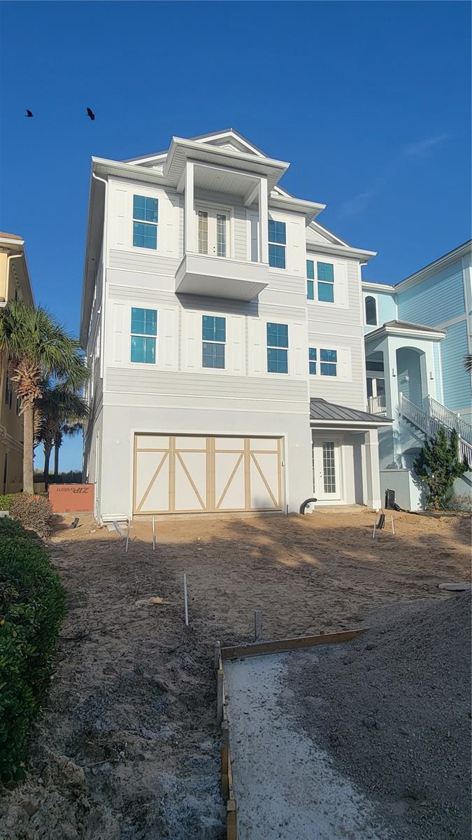 Under contract-accepting backup offers. Under Construction. Brand-new oceanfront home in Cinnamon Beach! Why wait years to build when you can own a new house on the beach right now, without all the hassle of the design and construction process? This incredible beachfront residence offers breathtaking views of the Atlantic, private pool, and dedicated boardwalk for instant access to the beach. All three luxurious living levels are serviced by an interior elevator, so it’s a breeze to go up and down with groceries or luggage. The ground level offers 2 spacious guest bedrooms, a game room for your friends and family to gather, and access to the pool and patio area. Lounge all day in the sun, or use your private walkway (shared with one neighbor) to get your toes in the sand in no time! The second floor is the main living level, and features an open-concept living area, dining space with a view, gourmet kitchen and bar area for entertaining. Mesmerizing ocean views draw you to the massive 35-foot long balcony. This is an ideal spot for the whole family to gather and recharge to the sound of waves crashing in on the shore. The kitchen features a huge island with breakfast bar seating and fabulous prep space. Smell the coffee brewing in the morning, and effortlessly carry it out to the large deck to sip on while you watch the sunrise. Two additional guest suites with full bathrooms are conveniently located on this floor, as well as a powder room just off the main area. Ascend the staircase or the elevator to the 3rd floor, where you’ll find the master suite of your dreams, which runs the full width of the house on the ocean. Wake each morning to the sun coming up over the Atlantic. Open up the sliders to your massive balcony and let the sounds of the sea rock you to sleep each night. Giant walk-in shower and soaking tub. You’ll never want to leave your room! There is 2nd master suite on the west side of the floor, ideal for visiting friend or family members that deserve spacious accommodations at your oceanfront estate. Cinnamon Beach is a privately gated neighborhood within the exclusive community of Ocean Hammock, a tranquil, coastal gem located in Palm Coast, Florida, just 20 minutes south of St. Augustine, 30 minutes north of Daytona Beach and 75 minutes east of Orlando. Featuring 2.5 miles of pristine cinnamon-toned beach, the community features a harmonious blend of Key West-styled homes. Community amenities include lakeside clubhouse with “zero-entry” pool for the little ones, water slide, fitness center, game room, bar/grille, lounge, and oceanfront pool complex with hot tub and access to the beach. Construction expected to be completed in late Summer 2023. An unprecedented opportunity to own a NEW oceanfront home in Cinnamon Beach! This one won’t last- don’t delay!