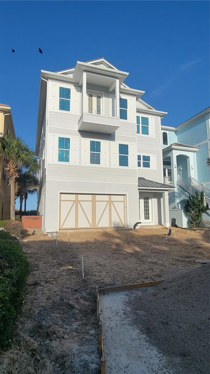 Under contract-accepting backup offers. Under Construction. Brand-new oceanfront home in Cinnamon Beach! Why wait years to build when you can own a new house on the beach right now, without all the hassle of the design and construction process? This incredible beachfront residence offers breathtaking views of the Atlantic, private pool, and dedicated boardwalk for instant access to the beach. All three luxurious living levels are serviced by an interior elevator, so it’s a breeze to go up and down with groceries or luggage. The ground level offers 2 spacious guest bedrooms, a game room for your friends and family to gather, and access to the pool and patio area. Lounge all day in the sun, or use your private walkway (shared with one neighbor) to get your toes in the sand in no time! The second floor is the main living level, and features an open-concept living area, dining space with a view, gourmet kitchen and bar area for entertaining. Mesmerizing ocean views draw you to the massive 35-foot long balcony. This is an ideal spot for the whole family to gather and recharge to the sound of waves crashing in on the shore. The kitchen features a huge island with breakfast bar seating and fabulous prep space. Smell the coffee brewing in the morning, and effortlessly carry it out to the large deck to sip on while you watch the sunrise. Two additional guest suites with full bathrooms are conveniently located on this floor, as well as a powder room just off the main area. Ascend the staircase or the elevator to the 3rd floor, where you’ll find the master suite of your dreams, which runs the full width of the house on the ocean. Wake each morning to the sun coming up over the Atlantic. Open up the sliders to your massive balcony and let the sounds of the sea rock you to sleep each night. Giant walk-in shower and soaking tub. You’ll never want to leave your room! There is 2nd master suite on the west side of the floor, ideal for visiting friend or family members that deserve spacious accommodations at your oceanfront estate. Cinnamon Beach is a privately gated neighborhood within the exclusive community of Ocean Hammock, a tranquil, coastal gem located in Palm Coast, Florida, just 20 minutes south of St. Augustine, 30 minutes north of Daytona Beach and 75 minutes east of Orlando. Featuring 2.5 miles of pristine cinnamon-toned beach, the community features a harmonious blend of Key West-styled homes. Community amenities include lakeside clubhouse with “zero-entry” pool for the little ones, water slide, fitness center, game room, bar/grille, lounge, and oceanfront pool complex with hot tub and access to the beach. Construction expected to be completed in late Summer 2023. An unprecedented opportunity to own a NEW oceanfront home in Cinnamon Beach! This one won’t last- don’t delay!