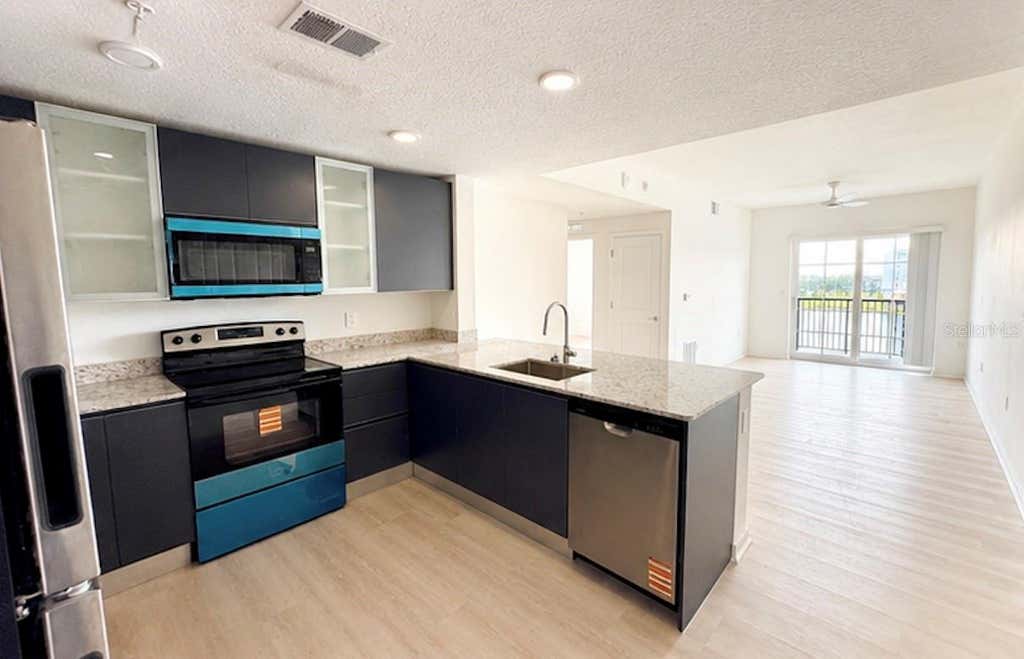 Photo of 5563 Millenia Park Boulevard #301, Orlando, FL 32839 (MLS # S5154322)
