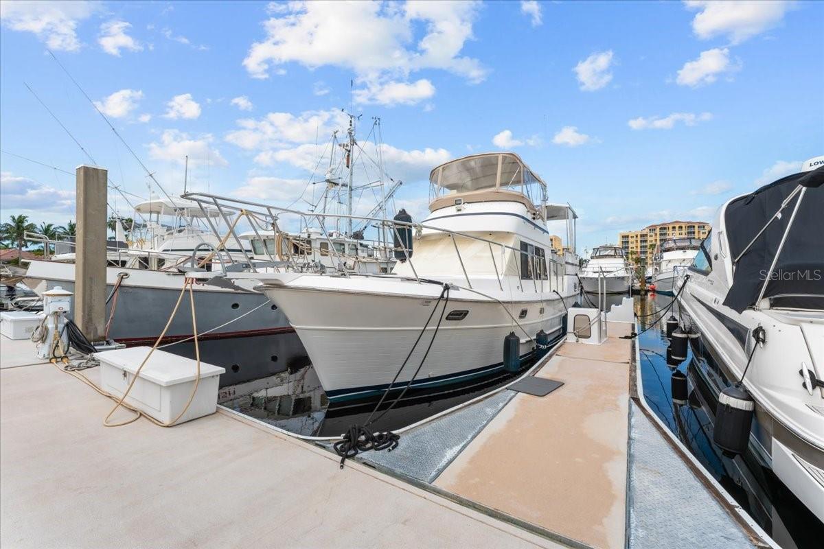 Own your piece of paradise with this premium deep-water boat slip at S-39 on South Dock at the highly coveted Riviera Dunes Marina. Located on Florida’s beautiful Gulf Coast, this protected marina is one of the safest harbors in the region with easy access to Tampa Bay, the Intracoastal Waterway, and the Gulf of America.
This floating dock slip measures 45' x 20.1', accommodates vessels up to 45 feet in length, and offers 50 amp shore power, pump-out at each slip, and Wi-Fi. Owners enjoy full access to the marina's resort-style amenities, including gated parking, 2 floating heated pools, pet walking area, social docks with 3 grills, laundry facilities, private bathrooms and showers, and on-site fuel dock.
With 24-hour gated security, Riviera Dunes offers luxury, safety, and convenience. Minutes from waterfront dining, downtown Bradenton, and Sarasota. The Dockside Restaurant is great place for food and drinks. Don't miss the Happy Hour Menu!
This is a rare opportunity to own in one of Florida’s top-rated marinas—perfect for seasonal boaters or as a rental investment! Purchased slips can also be rented and managed by the marina or owner. You do not need to own a home or condo to purchase a slip here at Riviera Dunes Marina.