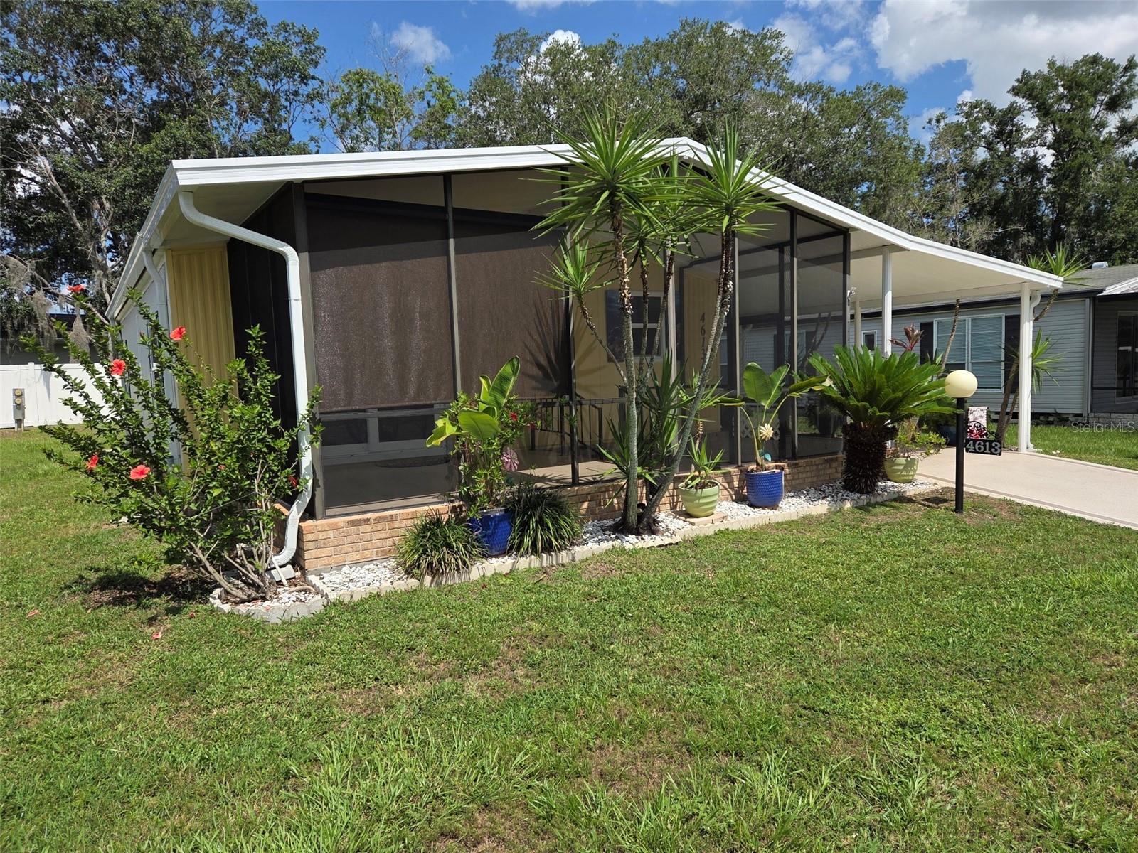VERY CLEAN 2 bedrooms, 2 bathrooms 1988 Palm Harbor home in a 55+ Mobile Home community. Walk in from the carport into the kitchen dining area, with updated appliances. Enjoy your morning coffee and relax on the front screened porch. This home has laminate throughout the home and ceramic tile in both bathrooms. Bring your golf cart and park behind the home in its own covered parking spot.
Enjoy the clubhouse and all the activities, swim, shuffleboard or fish in the lake.