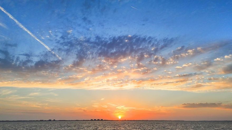 189 feet of rare boatable water frontage. Already cleared and elevated in preparation for a large contemporary estate, this nearly 1 acre lot offers generous buildable space and valuable privacy for your future vision. This extraordinary waterfront homesite offers some of the longest views to the West across Sarasota Bay and the Intracoastal Waterway. Significant estates, tree-lined streets and waterfront parks define this area. Coastal breezes always surround you; sunsets are, as you might imagine, spectacular. Driving down Indian Beach Lane provides a grand approach and beautiful introduction to this special location. Located in Indian Beach / Sapphire Shores - home to some of the finest historical architecture in all of Sarasota! And today, much like 100 years ago, it is being rediscovered by those with vision, appreciation and means. This coastal neighborhood has been a coveted location since around the time of its “founding” residents like the Ringling family and other prominent early Sarasotans. Water birds and peacocks are regular visitors here. Positioned perfectly between Sarasota-Bradenton International Airport (SRQ) and downtown Sarasota, yet still within short proximity to Longboat Key, St. Armands Circle and Lido Key. This particular location on Sarasota Bay also provides one of the most coveted features of all – boatable water to the site. Whether it’s a luxury yacht or something a bit more modest, access and dockage will be effortless. This homesite sits amongst other significant luxury homes – elegant coastal to the North, Mediterranean to the South with vintage and contemporary to the East. A site study including surveys and analysis is available, as are plans from one of the most renowned builders in the region. Or create your own masterpiece…your canvas awaits!