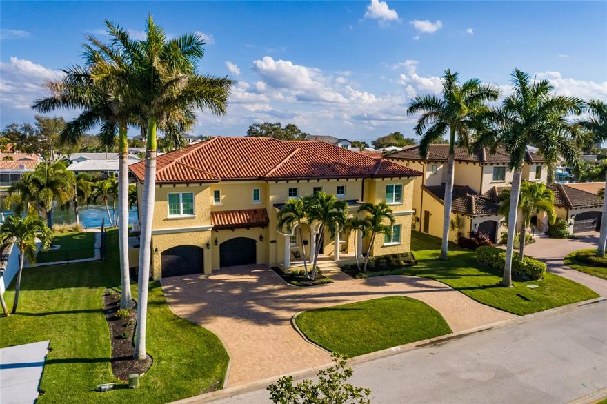 Built by respected builder John Wallace for his own family, this exceptional residence is one of the finest waterfront builds in Pinellas County. Designed for luxury, livability, and peace of mind, the home combines high-end finishes with superior storm-ready construction.
A grand two-story entry with coffered ceilings, transom windows, wrought iron staircase and rich custom millwork sets the tone. Solid core doors, crown molding, and built-ins throughout reflect true quality craftsmanship.
The ground floor is designed to be lived in, offering expansive living space that flows directly to the pool, patio, and dock—ideal for waterfront living and boating with two boat lifts (6K and 12K pounds) and protected canal access to open Tampa Bay. This level also works beautifully for multi-generational living, featuring two bedrooms, two full baths, a living room, and two separate bonus rooms.
Upstairs, the kitchen is the center of the home, opening seamlessly to informal living and dining areas. It features a full Thermador appliance suite, massive granite island with, prep sink, wine cooler and pullout drawers. There is a separate counter with seating, triple sink with pass-through to Living Room and breakfast nook. Entertaining is effortless with a separate service kitchen, plus a formal dining room for special occasions.
The second-floor living area opens to a balcony overlooking the water-perfect for relaxing, entertaining, or watching all of the outfdoor boating activity. The primary suite offers double-door entry, custom built-ins, and a spa-style bath with jetted tub and dual vanities.
Built with insulated concrete forms (ICF), reinforced pilings, a double sea wall, elevated lot, hurricane-impact windows and doors, hurricane-rated garage doors, flow-through garage vents, and a whole-house Generac generator, this home offers exceptional safety and performance during storms. Additional features include an elevator, heated saltwater pool and spa, composite dock, reclaimed water irrigation, and active Sentricon system.
Located in a walkable, social waterfront neighborhood, this is a must-see home for those seeking luxury, family flexibility, and true peace of mind. Ask your Realtor for the full list of features and safety details.