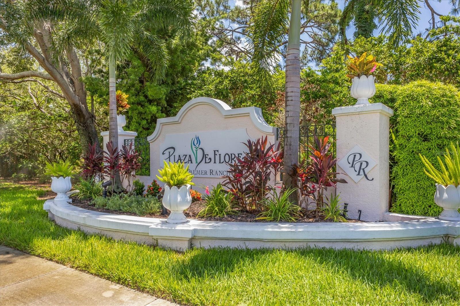 Step into a world of tranquil luxury at Plaza de Flores, an exclusive gated community that creates a serene lifestyle. Nestled in a coveted corner of this picturesque neighborhood, discover a 2-bedroom, 2-bathroom sanctuary offering an open layout that exudes Florida elegance and comfort. Upon entering the condo, you are greeted immediately by the view of a stunning screened-in lanai and tranquil pond - the perfect spot to savor your morning coffee in the mornings or a glass of wine in the evenings. The seamless flow from the kitchen to the charming dining nook with dry bar and into the inviting living room creates an atmosphere that beckons you to unwind and entertain in style. Designed for utmost privacy, the bedrooms are strategically positioned on opposite ends of the condo. Your lavish primary suite beckons with sliding glass doors to the lanai, natural light, dual walk-in closets and an en-suite primary bathroom featuring dual sinks, and a separate water closet with standing shower. The versatile second bedroom has a space-efficient layout with a sleeper-sofa, desk, hutch, and closet. The second bathroom offers the convenience of both a shower and a bathtub. Additionally, the there is an in-unit washer-dryer laundry closet. Outside, immerse yourself in the meticulously maintained grounds adorned with mature landscaping, tranquil ponds, and soothing fountains. Enjoy resort-style amenities including a geothermal heated pool, in-ground spa, gazebo over a lake, tennis court, and a charming clubhouse equipped with a fitness center, card room, library, kitchen, and flexible gathering space. Perfectly situated in proximity to shopping destinations, one mile from The Legacy Trail, and under 5 miles to famed Siesta Key, Plaza de Flores offers an enviable location, creating a lifestyle of both comfort and convenience. Don't delay, this remarkable haven is awaiting you. To see updates to furniture or linens, video available upon request.