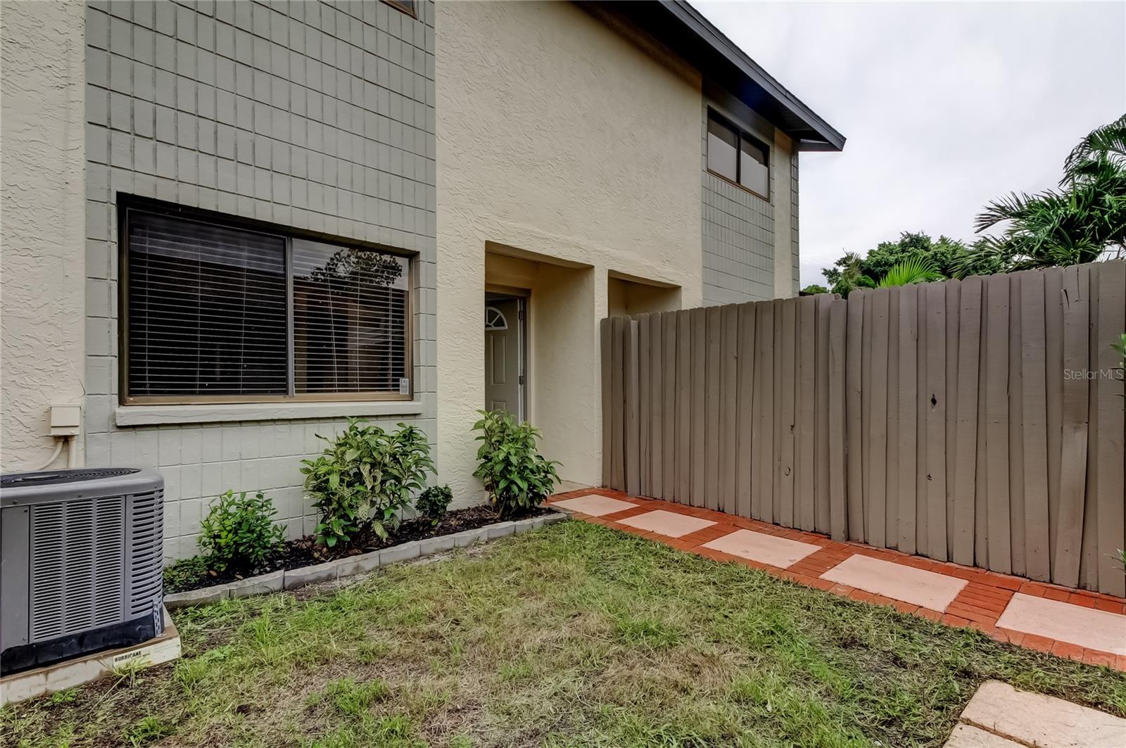 What a lovely, spacious 2 bedroom with a bonus room, 2.5 bathroom townhouse available now! The HOA fee includes CABLE, INTERNET, WATER, SEWER, TRASH, POOL, DOG PARK and MORE!! NO FLOOD ZONE in Pinellas county! The Roof, HVAC and water heater are all NEW as of 2022! As well as the washer and dryer, oven, microwave and dishwasher. BRAND NEW Fridge 2025. There is SO much to enjoy about this home from brand new toilets, vanities and other updates in all 3 bathrooms, a cute, private courtyard, a fully enclosed florida room with beautiful windows that provide a peaceful view of the pond to a wood burning fireplace, high ceilings and more! The first floor features a spacious living room, a laundry closet, a half bathroom and a versatile bonus room. On the second floor, you will have a split floor plan with full bathrooms in each bedroom. Off of the primary bedroom there is a large balcony that faces trees and the pond providing a private, quiet, outdoor space. This Townhouse is in a super convenient location where you are close to stores, restaurants, gas stations, shopping and more all while feeling secluded once you enter your home. There is so much more to discover about this home so come see it for yourself today! ** SELLER IS OFFERING 2% TOWARDS CLOSING COSTS IF REASONABLE OFFER IS SUBMITTED BEFORE 9/31**