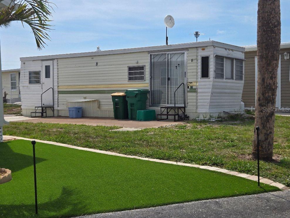 This small mobile home is on a nice lot across from the pool. This park is like living in a resort setting. The low condo fees ($140) monthly covers lawn Maintenace, water and sewer, very active club house, Bocci Ball, shuffleboard, laundry rooms, public rest facilities and much, much more. Located close to Manasota Key and the Beautiful Sand Beaches. There are many stores, shops, restaurants, medical facilities, golf courses, marinas and great fishing spots close by.