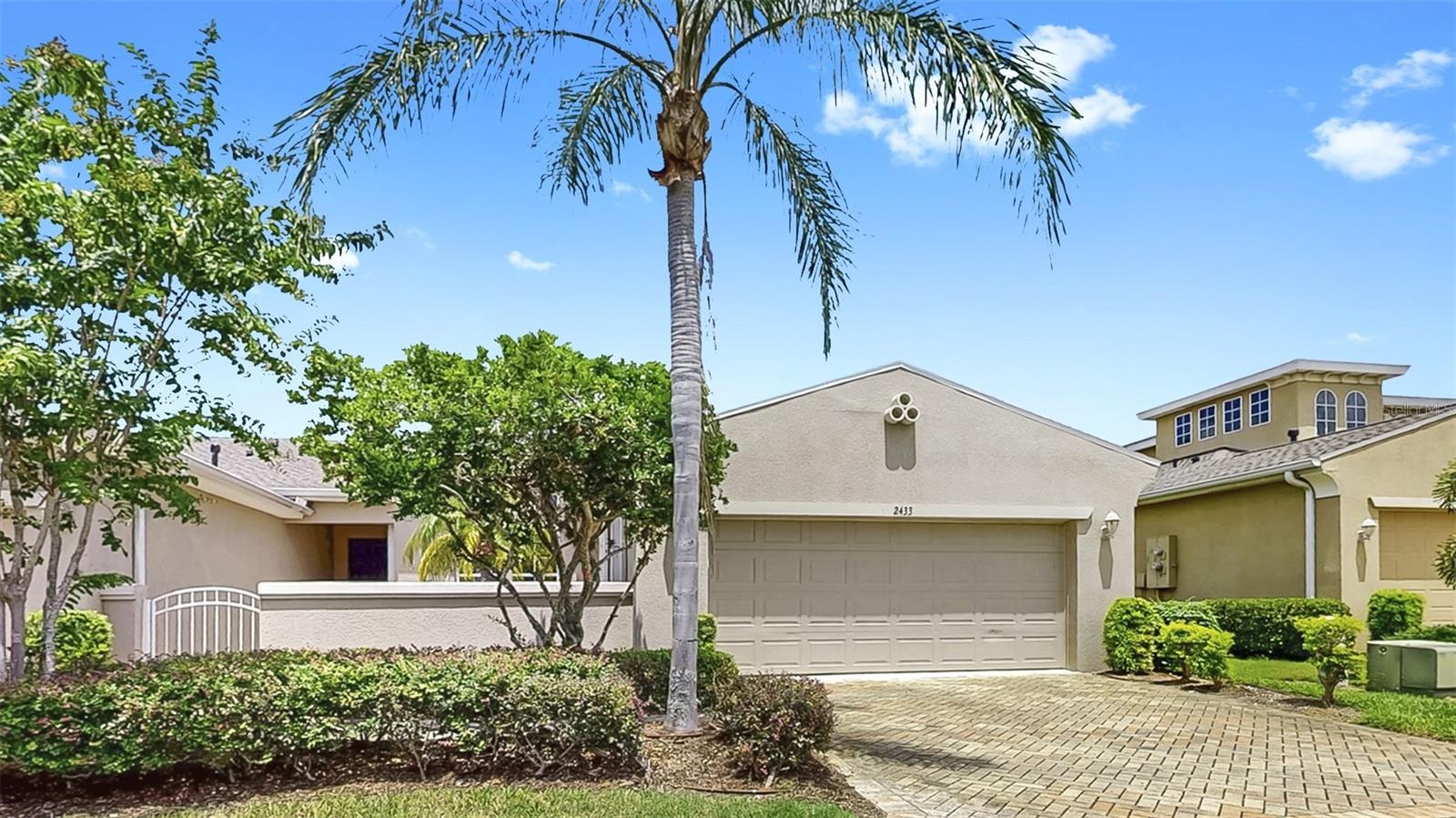 One or more photo(s) has been virtually staged. Charming golf course home in the prime, gated neighborhood of Kings Point in Sun City Center. Don't miss this beautifully maintained spacious 2-bedroom, 2-bathroom home, ideally situated on a peaceful street with serene golf course views. Located in Sun City Center, one of Florida's premier 55+ retirement communities, this residence offers comfort, convenience, and an exceptional lifestyle. Walk through the front courtyard and step inside to discover a thoughtfully designed split-bedroom floor plan that ensures privacy and functionality. There is no carpet in the home for easy maintenance. The second bedroom has a Murphy bed that remains in the home along with all appliances and a washer and dryer. Adjacent to the large kitchen is a space that can be used as a dining area, office, or even a reading room. The large outside screened lanai overlooks the golf course, ready for those relaxing days and nights. Hurricane shutters for all windows. Monthly HOA includes lawn care, water, sewer, cable, and internet, along with everything this vibrant community has to offer.