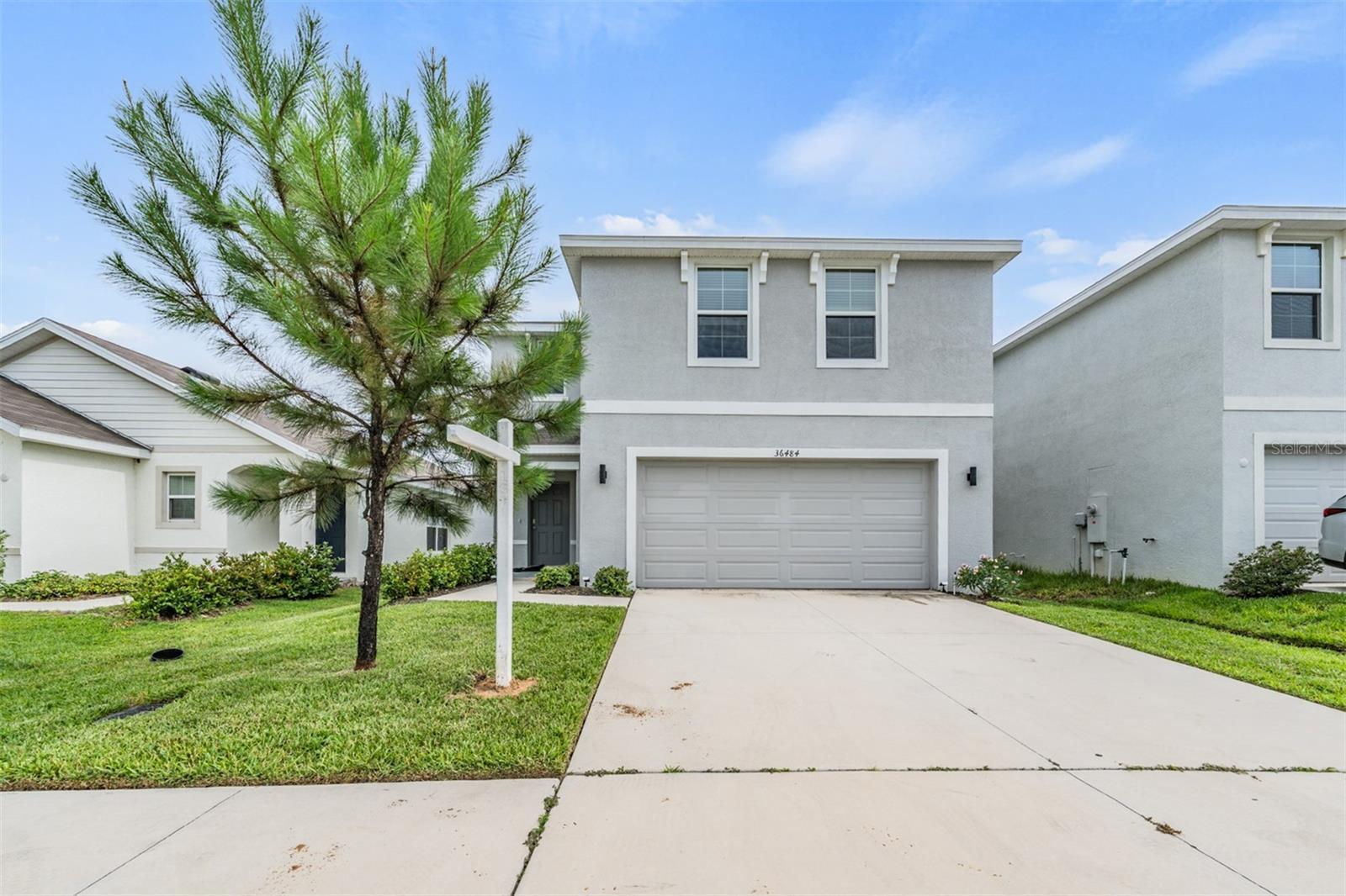 Welcome to this beautifully maintained, newly built home nestled in the sought-after Heritage Hills community. This spacious 4-bedroom, 2 story home offers the perfect blend of modern comfort, smart features, and everyday functionality. Step inside to discover an open-concept layout with granite countertops, a large kitchen island, 42" cabinetry, and a generous walk-in pantry—ideal for entertaining and everyday living. Upstairs, you'll find a versatile loft space perfect for a home office, playroom, or second living area. The primary suite offers a walk-in closet and en-suite bathroom with double sinks, while the additional bedrooms are thoughtfully laid out for privacy and space.
Additional highlights include updated energy-efficient, modern construction standards and smart home technology. The backyard is fully fenced, perfect for privacy, family, and pets. Enjoy your 2-car garage offering plenty of space for additional storage. Enjoy low living expenses with no CDD, low HOA and no flood zone insurance needed. Enjoy access to community amenities like a park and playground, all while being conveniently located near top-rated schools, Advent Health Hospital, St. Leo University, the Pasco County Fairgrounds, and the historic downtown Dade City. With shopping, dining, and major roadways nearby, this home truly checks all the boxes for comfort, convenience, and value. This is your chance to own a move-in-ready, modern home in one of Dade City’s most desirable communities. SELLER'S PREFERRED LENDER IS OFFERING CREDIT TO QUALIFIED BUYERS THAT CAN BE APPLIED TOWARDS THE BUYER'S CLOSING COSTS OR RATE BUY-DOWN.