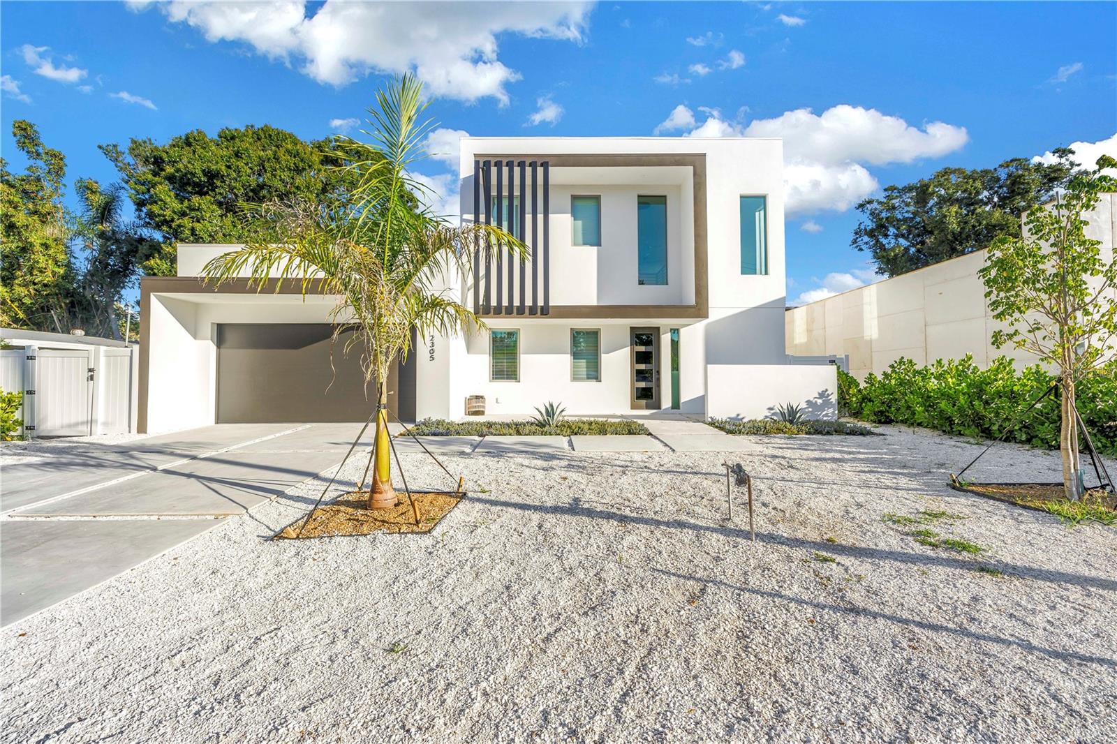 Tucked away on Temple Street, this stunning Sarasota home delivers the perfect mix of luxury, style, and comfort. With 5 bedrooms, 5 full baths, and 2 half baths (including a dedicated pool bath), every detail was designed for effortless living and entertaining.
Inside, bold black accents, designer lighting, and custom finishes set a sophisticated modern tone. The open layout flows seamlessly through the main living areas and a beautifully designed kitchen that’s as functional as it is striking.
Upstairs, a dedicated entertainment area with space for games and lounging offers the perfect hangout for family and guests. Step outside to your own private retreat featuring a heated pool and spa, outdoor shower, and a fully equipped outdoor kitchen ideal for dining and entertaining. Multiple balconies and shaded seating areas complete this exceptional property.
This home captures everything that defines modern Sarasota living—luxurious, inviting, and designed for unforgettable moments.