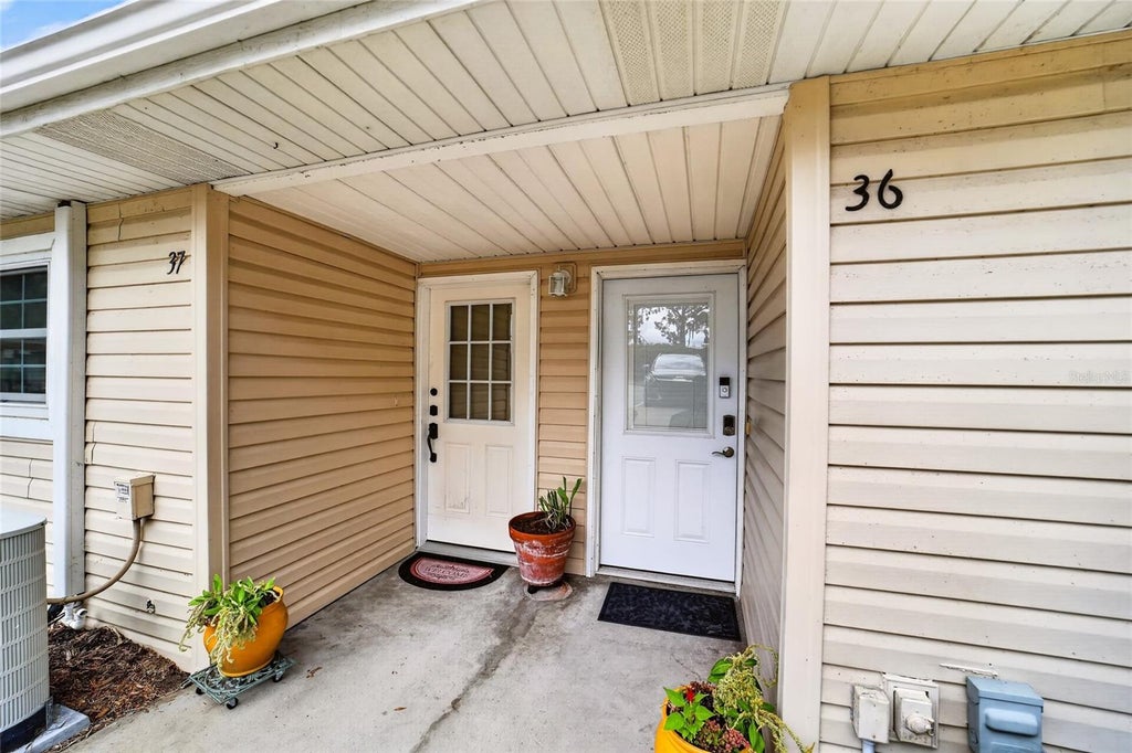 Photo of 11001 SE Sunset Harbor Road #E36, Summerfield, FL 34491 (MLS # OM733669)