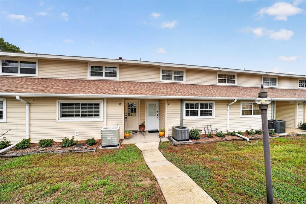 Photo of 11001 SE Sunset Harbor Road #E36, Summerfield, FL 34491 (MLS # OM733669)