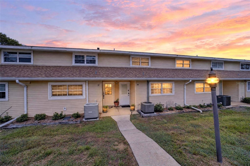 Photo of 11001 SE Sunset Harbor Road #E36, Summerfield, FL 34491 (MLS # OM733669)