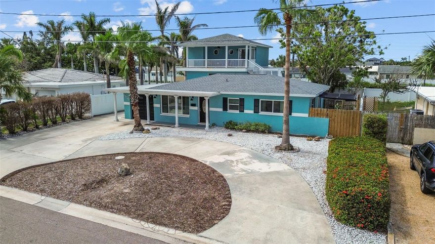 TURNKEY INCOME OPPORTUNITY — 2/2 front house plus two additional 1/1 units! Just 1 mile from Treasure Island Beach, this fully finished property offers three complete private living spaces, each with its own entrance—ideal for multigenerational living or for owners looking to offset expenses with rental income. The front home features 2 bedrooms and 2 baths, terrazzo floors, an updated kitchen with quartz countertops, impact windows and doors, newer roof and A/C, a circular driveway, and a 1-car garage. The back building includes two updated 1-bedroom units with private entrances, perfect for long-term tenants, extended family, or traveling professionals. Estimated rental income is approximately $6,250 per month, offering a strong return in a highly desirable coastal location. Fenced yard, deck, patio, updated lighting, and solid concrete-block construction complete the package. Property is zoned Single Family Residential; City of St. Petersburg rental regulations require a minimum lease period of 1 month.