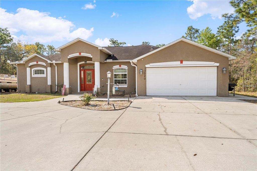 Photo of 13040 Quigley Avenue, Weeki Wachee, FL 34614 (MLS # TB8505140)