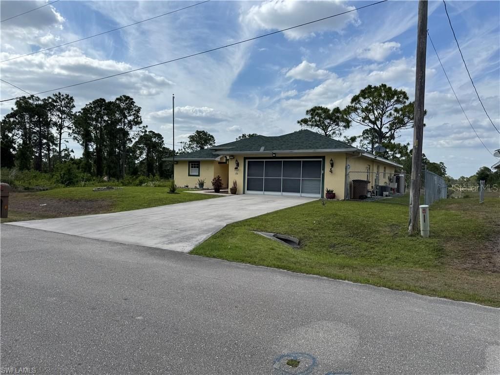 Photo of 1127 Foggia Street E, Lehigh Acres, FL 33974 (MLS # A4649505)