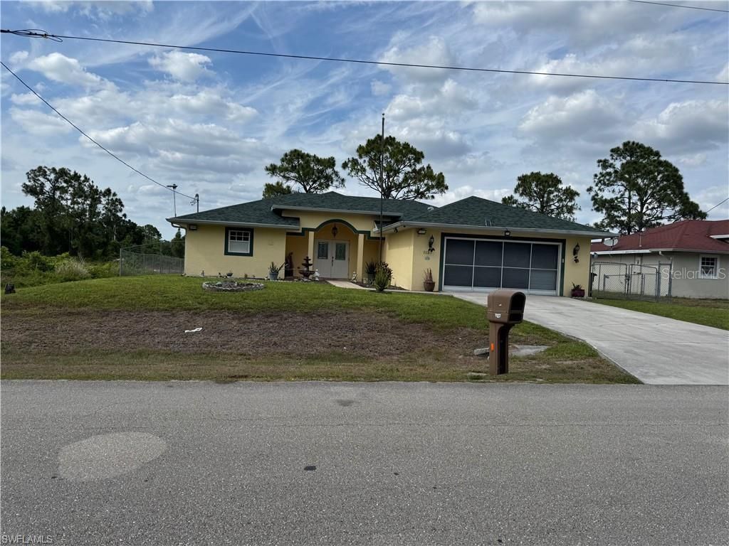 Photo of 1127 Foggia Street E, Lehigh Acres, FL 33974 (MLS # A4649505)