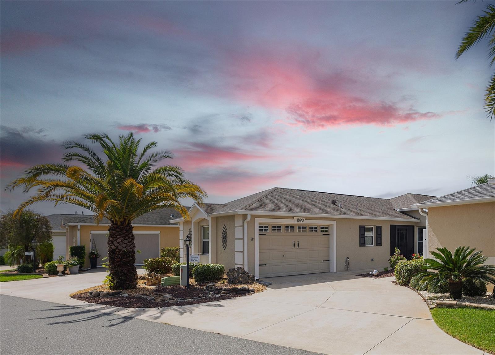 Welcome Home to this stunning Foxglove Courtyard Villa, located in the Village of Pennecamp minutes from Lake-Sumter Landing and Brownwood Town Centers. As you approach the home, the inviting SCREENED ENCLOSED ENTRY greets you, offering a perfect place to relax and enjoy the Florida breeze. Step inside, and you’re immediately captivated by the open, airy feel created by the SOARING VAULTED CEILINGS , accentuated by elegant CROWN MOLDING that adds a touch of sophistication throughout the home.
The spacious living area, featuring luxurious LVP FLOORING, flows effortlessly, making it ideal for both intimate gatherings and larger celebrations. CUSTOM LIGHTING fixtures add warmth and style, while ARCHITECTURAL DETAILS enhance the home’s overall character.
Moving toward the heart of the home, the kitchen is a chef's dream. Equipped with NEWER STAINLESS STEEL APPLIANCES, including a sleek refrigerator, range, and microwave, this kitchen is as functional as it is beautiful. GRANITE COUNTERTOPS extend across ample prep space, offering plenty of room for meal preparation. WHITE CABINETRY and a PANTRY closet provides practical storage.
The primary suite, a true retreat, offers an expansive layout. Here, you’ll find a WALK-IN CUSTOMIZED CLOSET, designed for maximum storage and organization, making it easy to keep everything in its place. The en-suite bathroom offers GRANITE countertops and a large vanity.
The two guest bedrooms are equally impressive, featuring large windows that flood the rooms with natural light, and one has been designed with versatility in mind, easily serving as an office or craft room if needed. The second bathroom, also with granite counters, is conveniently located for guest use and offers both style and function.
Step outside into the peaceful, private courtyard where the magic of outdoor living truly comes to life. The COVERED LANAI is perfect for enjoying your morning coffee or relaxing after a day of activities. The lanai opens to a large birdcage with a canvas cover, creating a serene, protected space for outdoor enjoyment. Surrounded by lush tropical landscaping, the area features a TRANQUIL WATERFALL FEATURE that adds a calming ambiance to your outdoor oasis.
With NO BOND balance, this villa offers peace of mind, along with a ROOF that's just 3 years old, a NEW HOT WATER HEATER , and a whole-house water softener and filtration system, ensuring comfort and convenience. This home truly offers a perfect blend of design, function, and relaxation. Come experience the exceptional lifestyle this Foxglove Villa provides, and discover your ideal piece of paradise in The Villages.
Click on VIDEO TOUR #1 to experience a video tour of this amazing home.