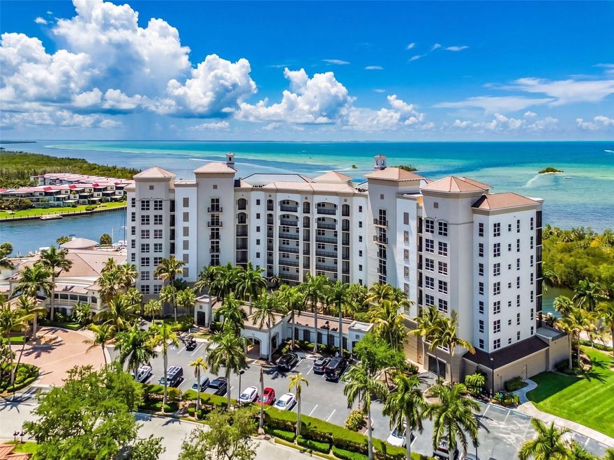 Set within the luxury community of Grande Isle in Burnt Store Marina, this beautifully appointed residence delivers an exceptional waterfront lifestyle with sweeping, panoramic views of Charlotte Harbor—truly a MILLION-DOLLAR VIEW AT HALF THE PRICE. From BREATHTAKING SUNSETS, to the ever-changing scenery of passing boats, dolphins, and manatees you’ll enjoy a daily experience that reminds you why you live here. Offered TURNKEY FURNISHED, this spacious 3 bed, 2 bath residence is thoughtfully designed for both comfort and style. The open-concept kitchen is ideal for entertaining, featuring rich hardwood cabinetry, expansive counter space, a generous breakfast bar, and under-cabinet lighting—and perfectly positioned so the chef never misses the view. The main living areas are enhanced by elegant diamond-set tile flooring, while soft Berber carpet adds warmth to each bedroom. The owner’s suite is a private retreat, showcasing stunning water views, direct lanai access, and a spacious ensuite bath with dual vanities, a soaking tub, and a seamless glass walk-in shower. Guests are equally well accommodated in a split-bedroom layout with two bedrooms and a full bath. Plantation shutters, updated lighting fixtures, and a separate laundry room further enhance the space. The welcoming lanai will be a favorite spot to unwind while overlooking both the Harbor and the Marina canal below. Motorized HURRICANE SHUTTERS provide effortless protection, and the convenience of an ASSOCIATION MAINTAINED AC SYSTEM adds peace of mind. Residents of Grande Isle enjoy a host of resort-style amenities, including a Clubhouse featuring Grande Salon for community events, well-equipped fitness room, sauna and steam room, huge heated pool and spa, theater room, private storage closet and an underbuilding dedicated parking spot. The rest of the gated community of Burnt Store Marina enhances an active lifestyle with a popular fitness, tennis and pickleball center, 27 hole public executive golf course, Activity club, Yacht Club, Freedom Boat Club, a Ship’s Store and 2 onsite restaurants, weekly Food Trucks and music  - and you can reach all in your golf cart. With the fastest access to open water among all the communities in SW Florida, you can boat all day and play at night. Don’t just imagine it – start living the lifestyle you dream about!