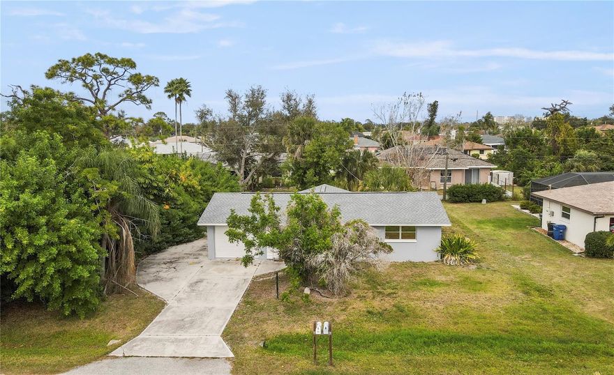 Looking for the perfect beach bungalow? This is it. Location truly sets this home apart, situated just 3.7 miles from Manasota Key Beach while offering peace of mind in an X flood zone, meaning flood insurance is not required. Centrally located, you’ll enjoy quick access to multiple nearby beaches, an easy drive north to downtown Venice or south to downtown Englewood for dining and shopping, and convenient proximity to CoolToday Park and Wellen Park for spring training games and year-round activities. This efficient 2-bedroom, 2-bath home features several key updates, including a new roof (2023), new hot water heater (2023), updated garage door (2016), Water Softner System (2023) and a Square D electrical panel. The oversized driveway provides ample space for a midsize RV or boat, and the chain-link fenced backyard is ideal for pets. Inside, you’ll find ceramic tile throughout, well-maintained interior finishes, abundant natural light, and a dedicated indoor laundry room. Whether you’re seeking a full-time residence, seasonal getaway, or investment opportunity, this home offers comfort, convenience, and an unbeatable coastal lifestyle. Homes like this, well-located, and outside of a flood zone don’t last long. Schedule your private showing today and start living the Florida lifestyle you’ve been waiting for.