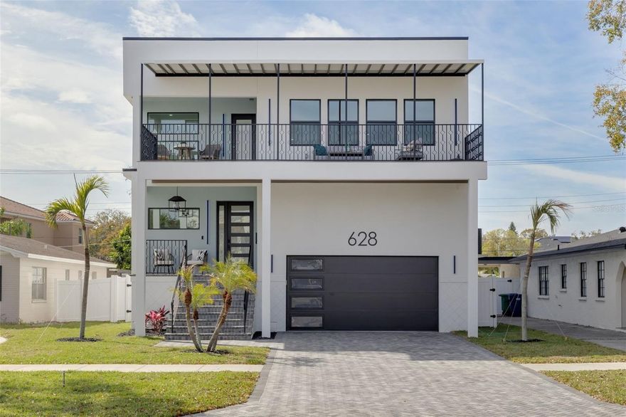 NEW PRICE + Builder INCENTIVE $15,000 towards buyer closing costs or rate buydown. Welcome to this modern new construction residence on the waterfront community of Davis Islands in Tampa Florida.  628 East (NOW WITH A POOL/SPA INCLUDED) is where modern design, water views and luxury living blend to form the perfect Islands lifestyle. This home features 5 bedrooms, 4.5 baths and 4,400 sq ft of living space that epitomizes contemporary design. Enjoy water views from the second floor covered entertainment balcony, the perfect spot to unwind and soak in the serene Tampa nights. A wonderful feature of the home is the expansive open floorplan with large rectangular Apolina White porcelain tiles that flow seamlessly throughout the first floor, creating bright and inviting spaces.  The culinary inspired kitchen boasts quartz countertops, a large central island with seating, wood cabinets, 6 range gas burner stove, floating hood, stainless appliances, soft-close cabinets and drawers, and an oversized 13’ x 6’ walk-in pantry. This level also has a private guest suite with full bath, that can serve as a future pool bath, as well as a designer half bath. The second floor consist of an oversized primary suite, flooded with natural light and offering water views through the numerous windows, as well as direct access to the entertainment balcony. The primary bath features a contemporary wet room with freestanding soaking tub, dual vessel quartz vanity, backlit vanity mirrors and two expansive walk-in closets with full built-ins.  There are three additional well sized guest bedrooms on this floor, with built-in closets and two additional full baths.  The outdoor space is fully fenced with plenty of space for a future pool and outdoor kitchen setup.  Additional features of this home include hurricane impact windows, GE monogram appliances, gas tankless water heater, backlit vanity mirrors in all bathrooms, elevated garage storage, nest thermostats, cedar closet built-ins and 10 multi-color controlled LED exterior lighting.  This home is just steps from the Davis Islands waterfront and two short blocks from the Davis Islands Village, with its multiple restaurants and shops. Located on an Island just outside of Downtown Tampa, Davis Islands has become the destination for professional athletes, executives and those who desire living within a walkable community. The Davis Islands community has all the amenities you could desire; including Marjory Park Marina, Sandra Freedman Tennis Complex, Tampa General Hospital, Historic Roy Jenkins pool, Peter O Knight airport, public boat ramp, dog parks, walking trail and more. Additionally, located only minutes from Downtown Tampa, Water Street Sparkman Wharf and the Tampa Riverwalk, makes this neighborhood a City within the City. Additionally, this home is located in the A rated Gorrie Elementary, Wilson Middle School and Plant High School boundaries.