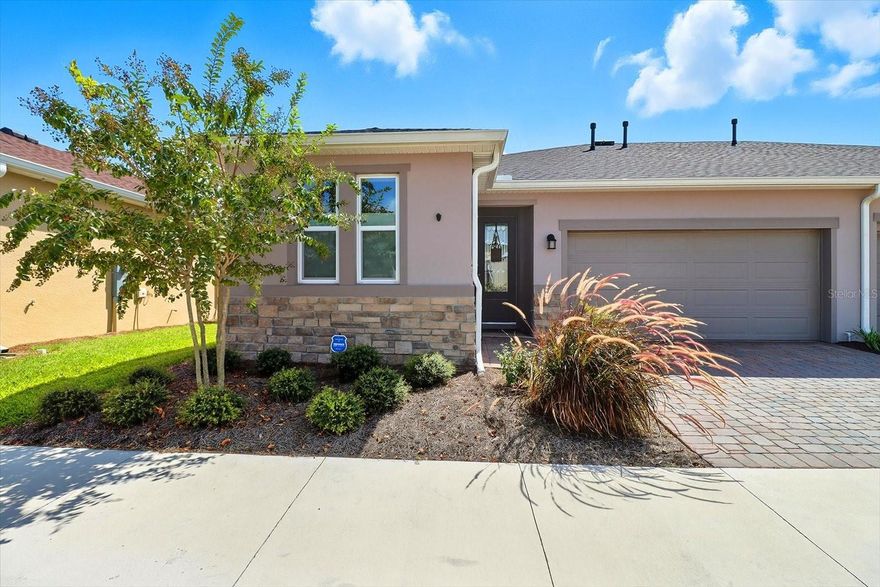 BETTER THAN NEW! LARGE FENCED YARD This 2024 Shea Aria Villa is perfectly positioned in the desirable Ocala Preserve community, which welcomes both 55+ and all age sections. Thoughtfully upgraded, meticulously maintained, and beautifully designed, this home blends comfort, convenience, and lifestyle in one exceptional package.

Step through the upgraded obscure glass entry door into a welcoming foyer. To the left, a private guest bedroom and full bath with a tub/shower combination create an inviting quiet retreat from activity in the living space of the villa. Continue down the hall to a versatile den—perfect for an office, fitness room, or hobby space—complete with a spacious closet housing a gas Whirlpool washer and dryer. 

At the heart of the home, the open-concept kitchen, dining, and living area is both stylish and functional. The kitchen features stainless steel gas appliances, maple cabinetry with dovetail drawers, soft-close hinges, pull-out pans, and gleaming Zanzibar granite countertops. 

The primary suite is a peaceful retreat with dual sinks, an upgraded tiled shower with glass door, and a custom-designed walk-in closet. Throughout the villa, you’ll find thoughtful finishes such as custom top-down/bottom-up blinds, enhancing light and privacy. 

A large sliding door opens the living space to a screened lanai, offering serene views of green space and direct access to community walking and biking trails. Prewired for fans and equipped with a gas hookup for your BBQ or firepit, this outdoor space is designed for both relaxation and entertaining. The garage adds even more: sealed driveway pavers, plumbing for a water softener, and a dedicated golf cart outlet.

This villa has been smoke-free, pet-free, and exceptionally cared for—offering true move-in readiness. HOA coverage includes exterior painting, schedule power washing, roof, irrigation, lawn care, access to a Tom Lehman–designed golf course and golf center and fishing, catch and release, on a private 7-acre lake.

Ocala Preserve Club offers
 Resort-style living with every convenience at your fingertips. 

State-of-the-art fitness center & spa locker rooms,
Luxury pool and lap pool, full-service spa,
Tennis, pickleball, kayaking, and
a vibrant calendar of clubs and social activities

The community is golf cart–friendly with shopping and dining just outside the gates. Location highlights include:

4 miles to the World Equestrian Center
15 minutes to HITS and Downtown Ocala
Quick access to I-75

With no CDD fees (saving thousands annually) and an assumable FHA loan at 5.875%, this home is not only a beautiful retreat but also a smart financial choice.

Perfect for full-time living or a seasonal getaway, this better-than-new villa offers the best of Ocala living—move-in ready and waiting for you.

All measurements to be verified by buyer.