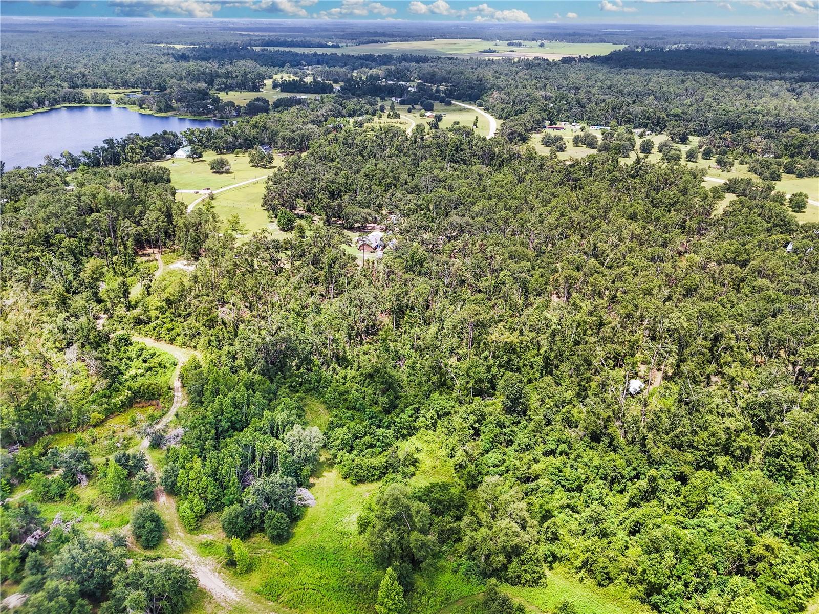 Discover this 1.5-acre lot tucked away in a quiet corner of Hamilton County, great for your future home or weekend getaway. The land is flat with beautiful mature trees, giving it a peaceful, natural vibe. It’s easily accessible with well maintained roads, and power lines are close by to make building even easier. With an very low HOA fee of only $95 per year, it’s a great spot without the heavy upkeep costs. Nature lovers will love being just minutes from Jennings Bluff Preserve and the Suwannee River - great for relaxing and activities outdoors. You'll also be short distance to town, where you’ll find local shops, restaurants, and schools. Whether you’re ready to build now or want to invest, this lot has tons of potential!