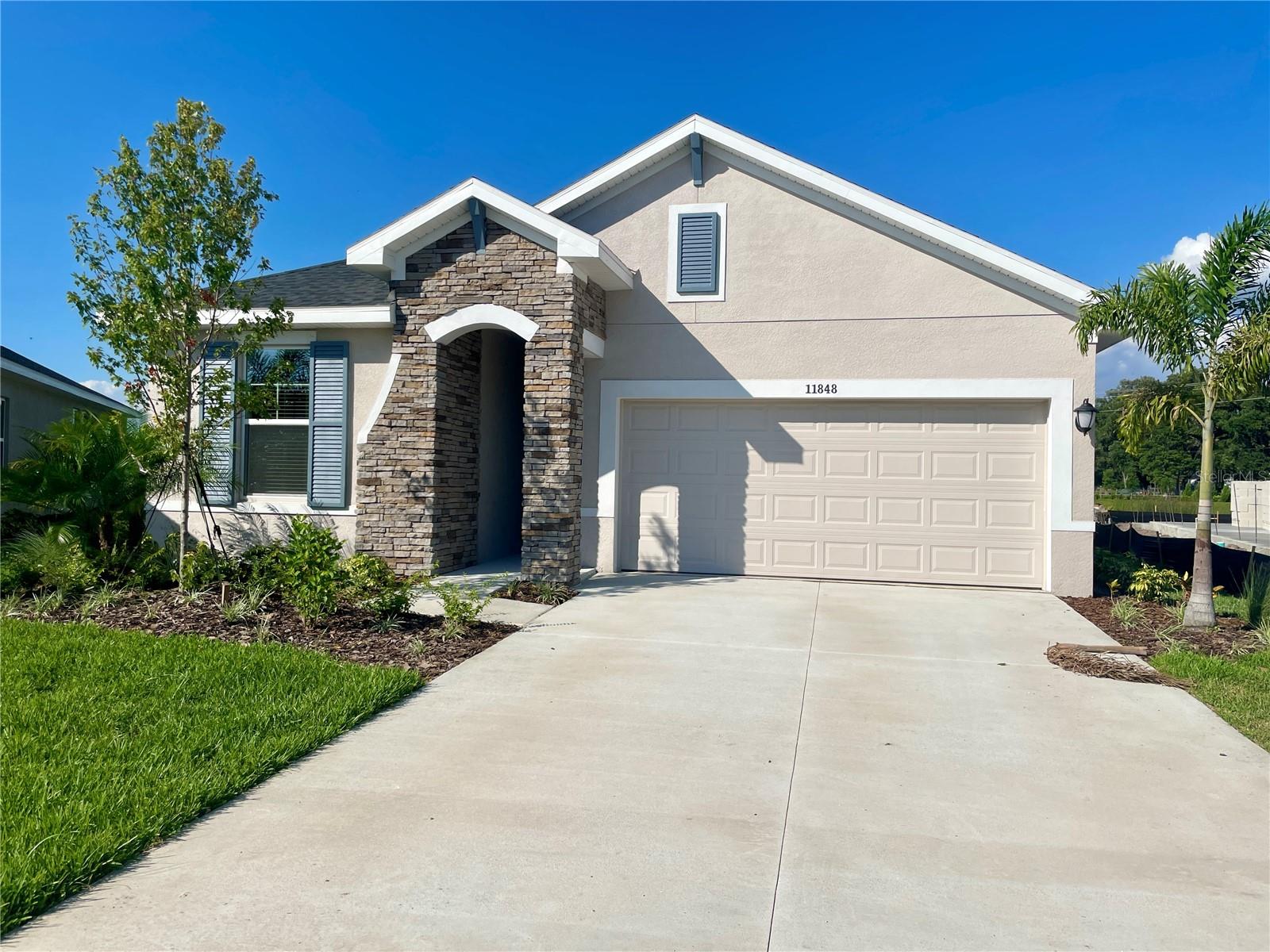 For Rent! Pet Friendly! Unfurnished Annual Rental available Immediately! Welcome to North River Ranch, a gated community in Parrish, where modern luxury meets convenience in this immaculate, move-in-ready home. This brand new, never lived in home, features 3 bedrooms, 2 bathrooms, a study, and a scenic view from the rear patio. Designed with an open floor plan, the residence includes an office/den, perfect for remote work or study. The kitchen is a focal point, boasting solid-surface countertops, stainless steel appliances, and a generous center island. Throughout the home, enjoy the comfort of luxury vinyl plank flooring, complemented by plush carpeting in the bedrooms. The master bathroom is a retreat with dual sinks, a walk-in shower, and a spacious walk-in closet. Step through the sliding glass doors in the living room to discover a large back patio with a serene pond view and lush green preserve. This tranquil setting is perfect for relaxing and entertaining. Residents of North River Ranch relish resort-style living with access to an array of amenities, including: Brightwood Pavilion: Resort-style pool, fitness center, game room, event lawn, playing field, playground, firepit, and clubhouse. Riverfield Verandah: Swimming pool, covered patio, and outdoor living room area. (Just a short walk from the home!) Community Welcome Hub: Grab-and-go Bike Share and Dash's Bark Park. Parks and Trails: Riverfield Pocket Park, Wildleaf Park, multiple Avid Fitness Stations, and a Bike Challenge Loop with 24+ miles of interconnected trails upon completion. Camp Creek Clubhouse: Canteen café, workspaces, business office, and The Nest living room area. The home is conveniently located near Allentown outlets, St. Pete, Sarasota, and downtown Tampa. Nearby, find schools, dining options, and supermarkets like Publix, all just a short distance away. Additionally, the home is within close proximity to Barbara A. Harvey Elementary School and Parrish Community High School, with Buffalo Creek Middle School also nearby. Seize the opportunity to make this modern home your dream sanctuary. Schedule your showing today and discover all that North River Ranch has to provide! Washer & dryer included with rental. Up to 2 dogs allowed with $150 one-time fee/dog. Lawn care maintained by the community.