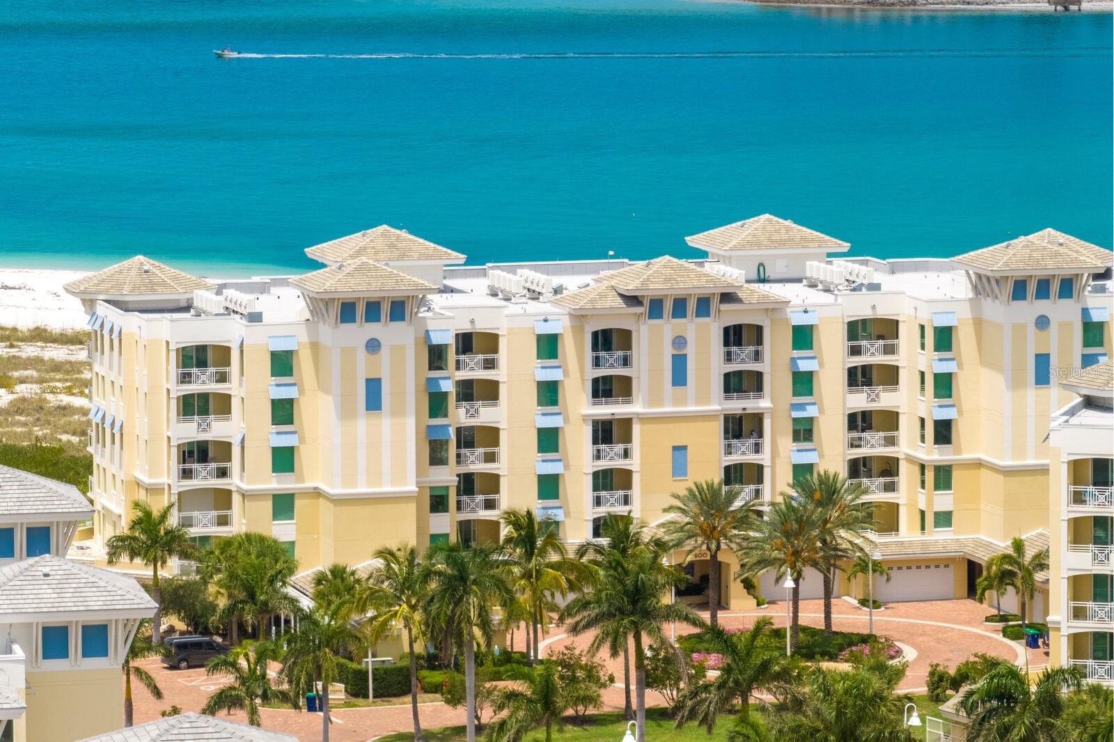 FABULOUS..BEACH..PARADISE..Welcome to Sunset Pointe at Collany Key..It's like living in an island resort with a private beach. This exclusive gated Beachfront community is located on the island of Tierra Verde and is adjacent to Shell Key, a 1,800 acre preserve and one of Pinellas Counties largest underdeveloped barrier islands located on the Gulf of Mexico. This RARELY available end-unit was built for luxury and privacy. The end-unit provides SIX additional side windows. The bonus window in the master offers an abundance of natural sunlight throughout and an extended beachside balcony has plenty of room for sunset dining and relaxation. Enjoy your two car private garage under the building, private air-conditioned storage room and elevator opening into your private foyer. Highly upgraded and customized, this open floor plan is designed for entertainment with breathtaking views from every window. Floor to Ceiling sliders open up to two separate private balconies. The kitchen is upgraded with Sub-Zero refrigeration and Wolf induction range, hood and microwave drawer. Built in Bar Cabinets offer a Sub-Zero Wine Chiller. All windows are thermal insulated, high impact glass and have automated Hunter Douglass window shades as well as Rollaway storm shutters. Enjoy spectacular sunsets 365 days a year with wide open views of the Gulf of Mexico, at night enjoy your unobstructed view of Tampa Bay's lighted Sunshine Skyway bridge. Incredible amenities include a Sunset Pavilion, two bocce ball courts, several fire pits and grills, a Geo-Thermal pool, spa, and fitness center, a waterfront board walk, dock and kayak launch is perfect for bird watching, fishing or navigating through the mangroves. If golf is your game join the waterfront Isla Del Sol Yacht & Country Club, 5 minutes to the North. Downtown St. Petersburg is only 10 to 15 minutes away and three international airports are within 25 to 60 minutes. Call Now and start enjoying the Beach Life.
