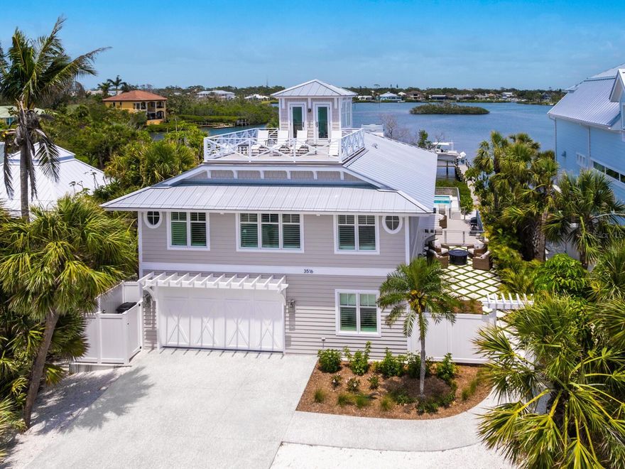 Casey Key Gulf-to-Bay | Private Beach | Curated Waterfront Residence.  
Welcome to this rare Gulf-to-Bay property on exclusive Casey Key, where timeless design meets modern coastal luxury. Reimagined and renovation completed in 2023— a new resort-style pool and spa added in 2025—this move-in-ready oasis offers private beach access, sweeping Intracoastal Waterway views, and a relaxed yet refined lifestyle.

Expansive open living spaces are filled with natural light and feature wide-plank wood flooring, exposed wood beams, and clean architectural lines. A working fireplace anchors the living room, connecting seamlessly to the great room and a chef-inspired kitchen.

The dual-concept kitchen is equipped with two Sub-Zero refrigerators, a Wolf range, two Asko dishwashers, and dramatic Zeus quartzite countertops. Custom cabinetry, designer lighting, and a spacious layout make it ideal for both everyday living and entertaining.

With four bedrooms, three and a half bathrooms, and a dedicated study/den, the floor plan offers flexibility and privacy. Upstairs guest suites enjoy spectacular water views from every room. An upper-level deck overlooking the Gulf is perfect for sunset viewing and quiet evening relaxation.

Built for coastal durability, the residence features hurricane-impact doors and windows, a standing seam metal roof, and cedar siding. Outdoors, the newly completed heated pool and spa, surrounded by lush tropical landscaping, create a private retreat. A 13,000 lb. boat lift and dock provide easy access to the Intracoastal for boating enthusiasts.

Casey Key is more than just an address—it's a lifestyle. This exclusive 8-mile island offers a rare blend of natural beauty, tranquility, and modern luxury. With pristine beaches, crystal-clear waters, and endless opportunities for water sports, it's a sanctuary for those seeking serenity and access to the vibrant culture of nearby Venice and downtown Sarasota.