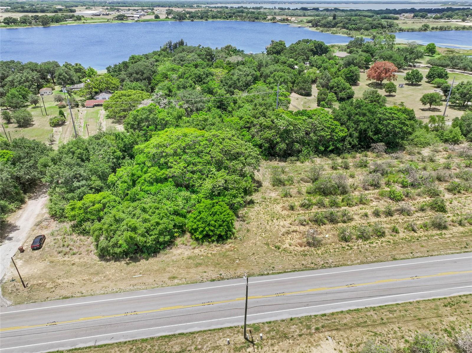 Build your dream home on this corner lot featuring .46 of an acre. This picturesque parcel is located in an established community with no monthly HOA. Conveniently located on a paved road near shopping, restaurants, schools, and Highway 27. As a residentially-zoned property, it offers the flexibility to design and build according to your preferences. We recommend that the buyer conducts their due diligence with the city and/or county to familiarize themselves with any building restrictions and requirements. For your convenience, a well and septic system will be required. This fantastic lot is situated in Haines City. There is an additional .85-acre parcel available to purchase (MLS number P4930676). Take advantage of this exceptional lot and turn your vision of a dream home into a reality.