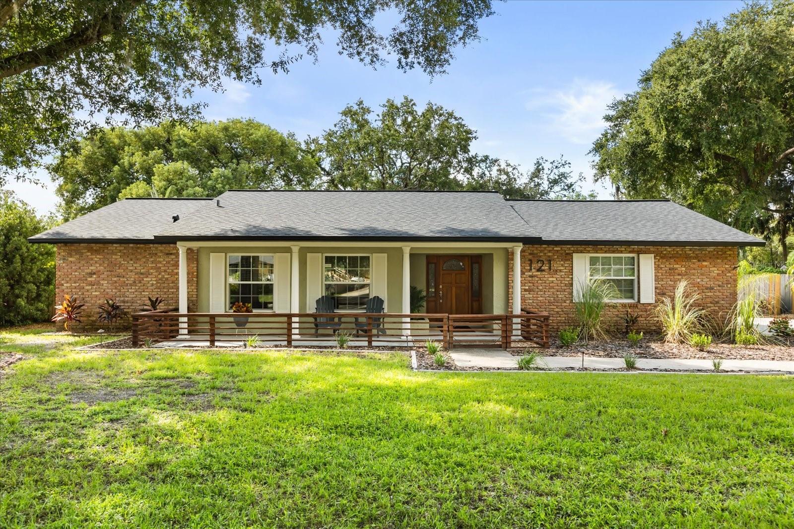 Within the highly desirable Tuscawilla golfing community, with miles of tree-lined sidewalks, this beautifully updated 4-bedroom, 2-bath split plan, pool home offers the perfect blend of neighborhood charm and modern luxury. Sitting on nearly a half-acre lot, this split floor plan home features over 2,000 square feet of living space with three separate patio areas, giving the home a larger feel and several areas in which to gather. The oversized 2-car garage also includes overhead and attic storage along with access to the private laundry room. The gourmet kitchen is the center of the home, boasting plywood cabinetry, both quartz and walnut countertops, a spacious island, and stainless steel appliances—perfect for both casual meals and entertaining. The luxurious owner’s suite includes private pool access and a spa-like bathroom with beautiful marble tile throughout and large walk-in closet. Timeless hardwood oak flooring throughout the home create a seamless feel, while the custom wainscotting and chic materials used give this home an upscale vibe. Step outside to your spacious screened-in lanai with an insulated roof, overlooking a sparkling private pool and fenced backyard, complete with a separate garden, full-size storage shed, and space for your boat or RV. Whether hosting friends after a day on the course or enjoying a quiet evening outdoors, this home offers the ideal Central Florida setting. Located on a picturesque street in a quiet golf community neighborhood, this home combines resort-style living with everyday comfort. Don’t miss your chance to tour this exceptional property today!