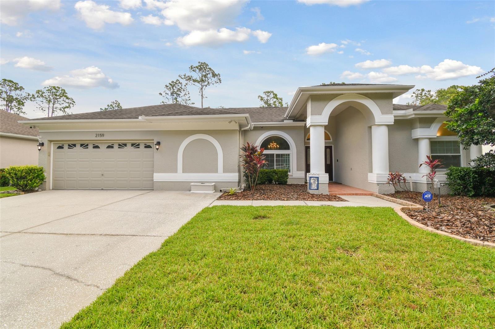 Settle in to your dream home in the coveted subdivision of Warwick Hills within Eastlake Woodlands. You'll be pleased to know this home sustained no damage from the 2024 hurricanes. Eastlake Woodlands is a renowned golf and tennis community that offers a full range of amenities for an additional membership including the fully remodeled Ardea Country Club, championship golf courses, tennis, pickle ball, resort style pools and more. This stunning 4bedroom, 3 bath pool home spans 2,673 sf and offers a bevy of upgrades. Step into the fully updated kitchen, featuring beautiful quartz counters, newer stainless steel appliances, updated cabinetry and large center island- perfect for any culinary enthusiast. The 3 way split floor plan boasts brand new wood floors throughout the main living area and primary suite, providing a warm and inviting atmosphere. Relax on the outdoor screened patio that faces a serene conservation area, where you can enjoy watching deer and other wildlife or splash in the cool pool. The spacious lot, over 8,000 sq. ft., offers plenty of room for outdoor activities and entertainment. Modern upgrades include a tankless water heater installed in 2024, brand new impact windows (except for the sliding door and corner windows) in 2023, and fresh exterior paint in 2024. The house also features a suburban propane tank and the patio is plumbed for gas, making it ready for an outdoor kitchen. Don‘t miss out on this incredible opportunity to own a meticulously maintained home in a desirable location. Schedule your showing today and experience all that this Eastlake Woodlands gem has to offer!
